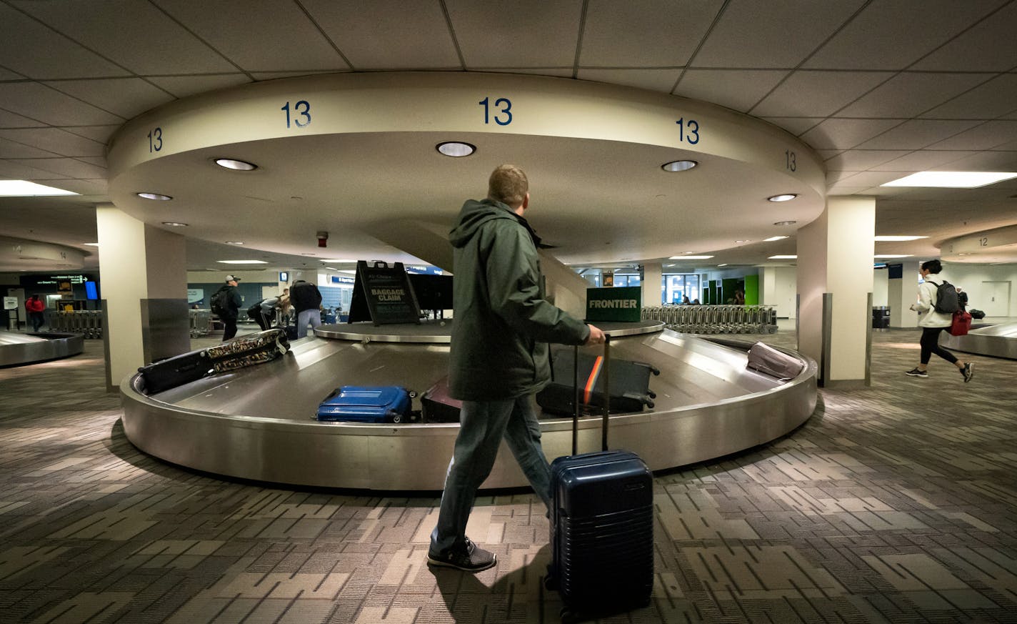 The baggage claim at the Minneapolis-St. Paul International Airport is in the midst of a multi-million dollar overhaul. Passengers collect their bags from small and dimly lit baggage carousels which will be replaced by a brighter larger baccage area. ] GLEN STUBBE &#x2022; glen.stubbe@startribune.com Monday, March 9, 2020 The baggage claim at the Minneapolis-St. Paul International Airport is undergoing a multi-million dollar overhaul. What's Happening at this time: Reporter name: Janet Moore. Re