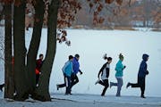 Members of No Quit Fit, braved the cold for an early morning workout at Central Park Victoria West, Saturday, December 6, 2014 in Roseville, MN. No Qu
