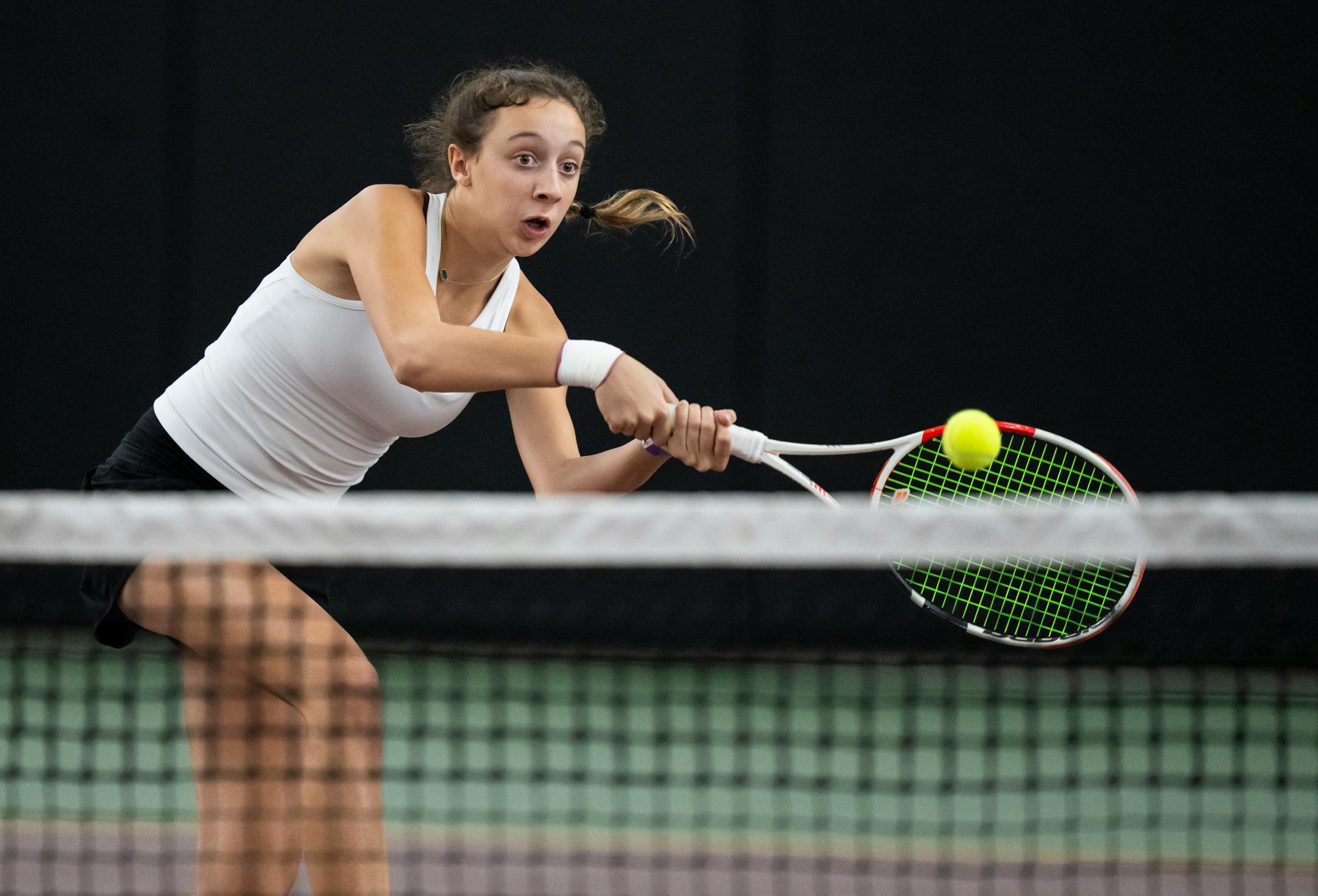 Maple Grove's Lexi Helmer-Jahnke hits the ball while playing first doubles with partner Amelia Larsen during the Class 2A team girls tennis quarterfinals against Elk River at Baseline Tennis Center at the University of Minnesota on Tuesday, Oct. 24, 2023 in Minneapolis.