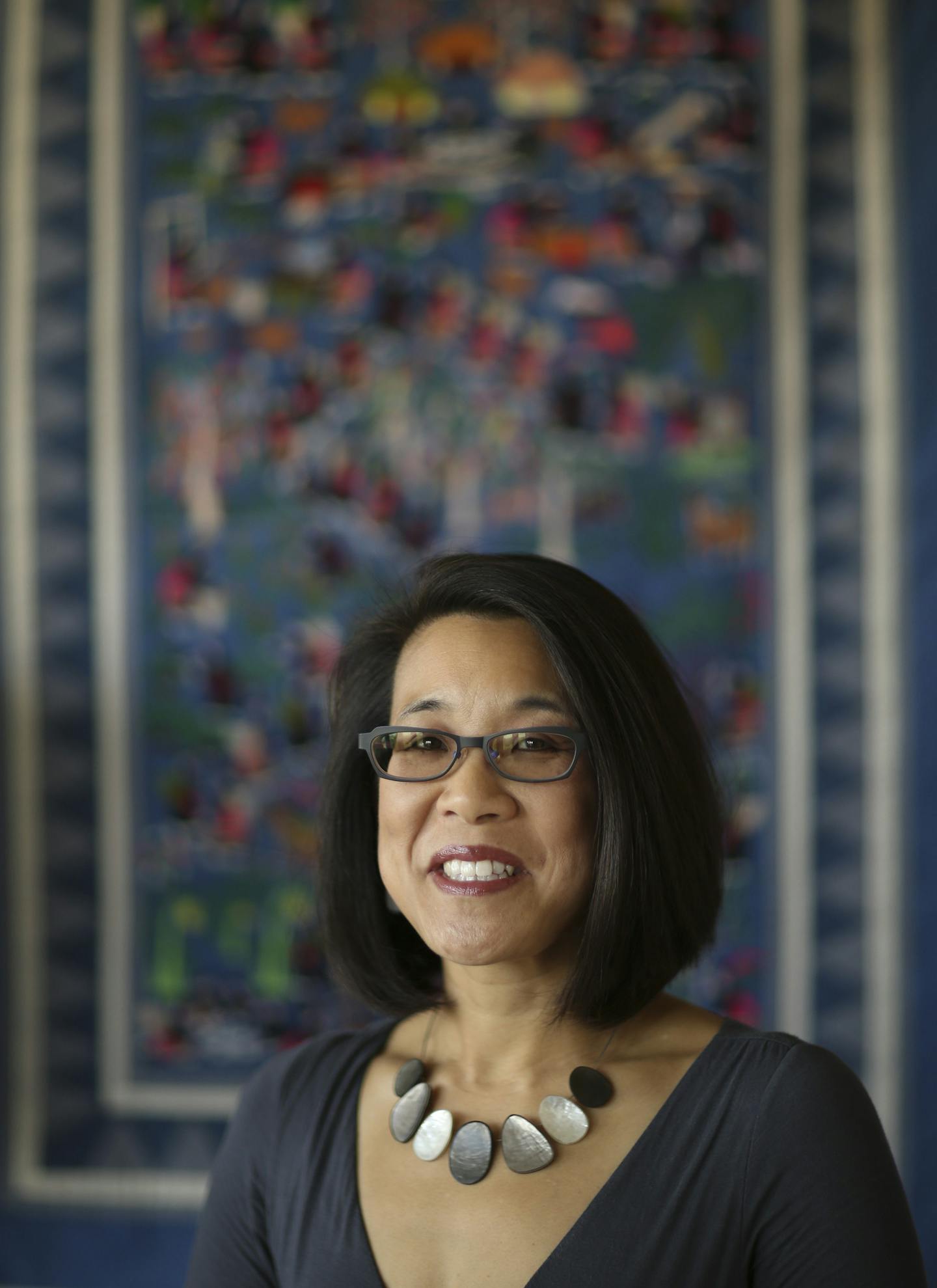 Erika Lee, historian and author, photographed in her office Tuesday afternoon. She's in front of a Hmong "story cloth." This textile depicts village life in Laos before the war. ] JEFF WHEELER &#xef; jeff.wheeler@startribune.com Erika Lee, historian and author whose sweeping book about the often-untold story of Asian immigrants to America is getting a lot of buzz. She was photographed in her office in the Elmer L. Andersen Library on the University of Minnesota's West Bank Tuesday afternoon, Oct