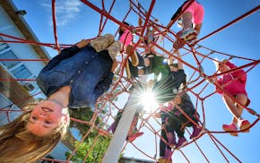 Fifth-grade girls played on a rope jungle gym at Normandale Elementary in Edina. A new form of structured play at recess is being tried out at two ele