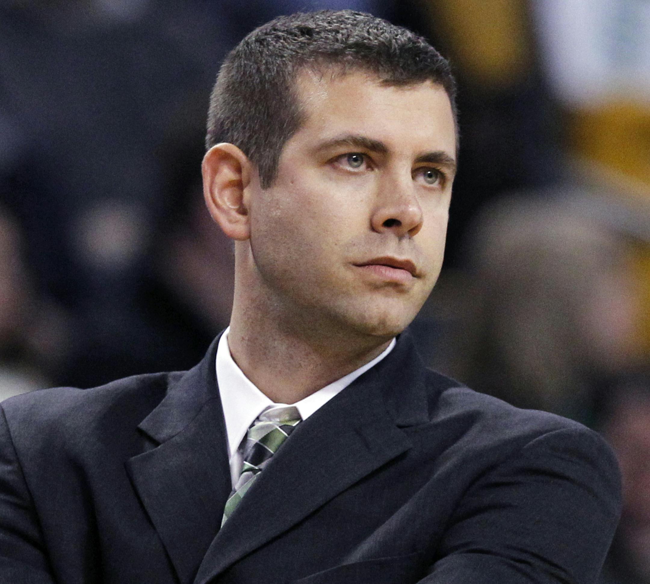Boston Celtics head coach Brad Stevens watches from the bench in the second half of an NBA basketball game against the Charlotte Bobcats in Boston, Wednesday, Nov. 13, 2013. The Bobcats won 89-83. (AP Photo/Elise Amendola)