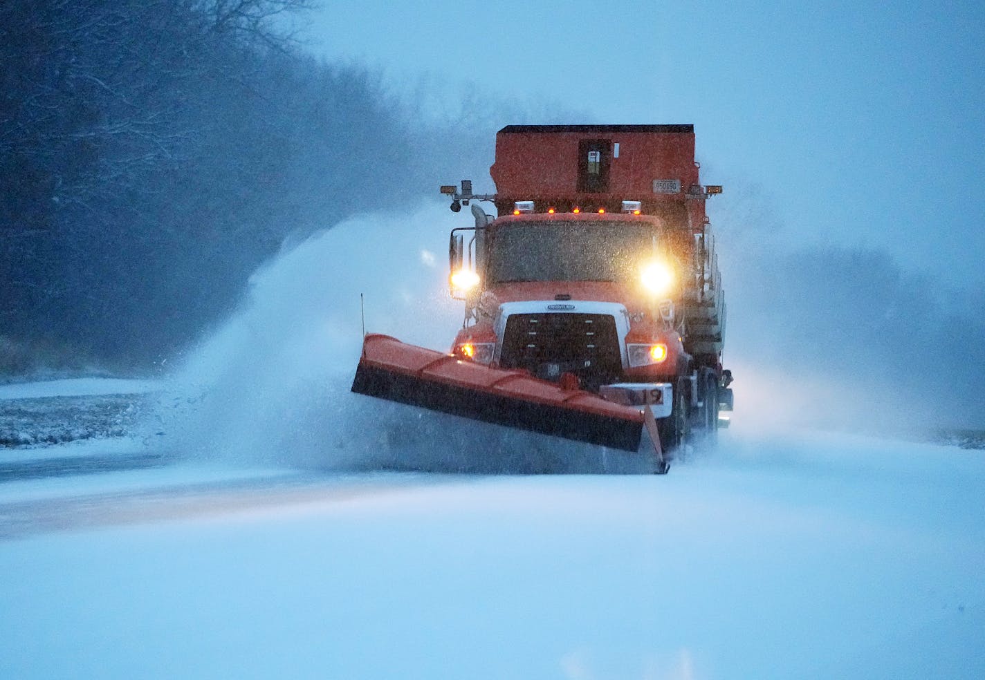 A snow plow pushes fresh snow from McAndrews Rd. on Tuesday, Nov. 29, 2022, in Apple Valley, Minn. (David Joles/Star Tribune via AP)