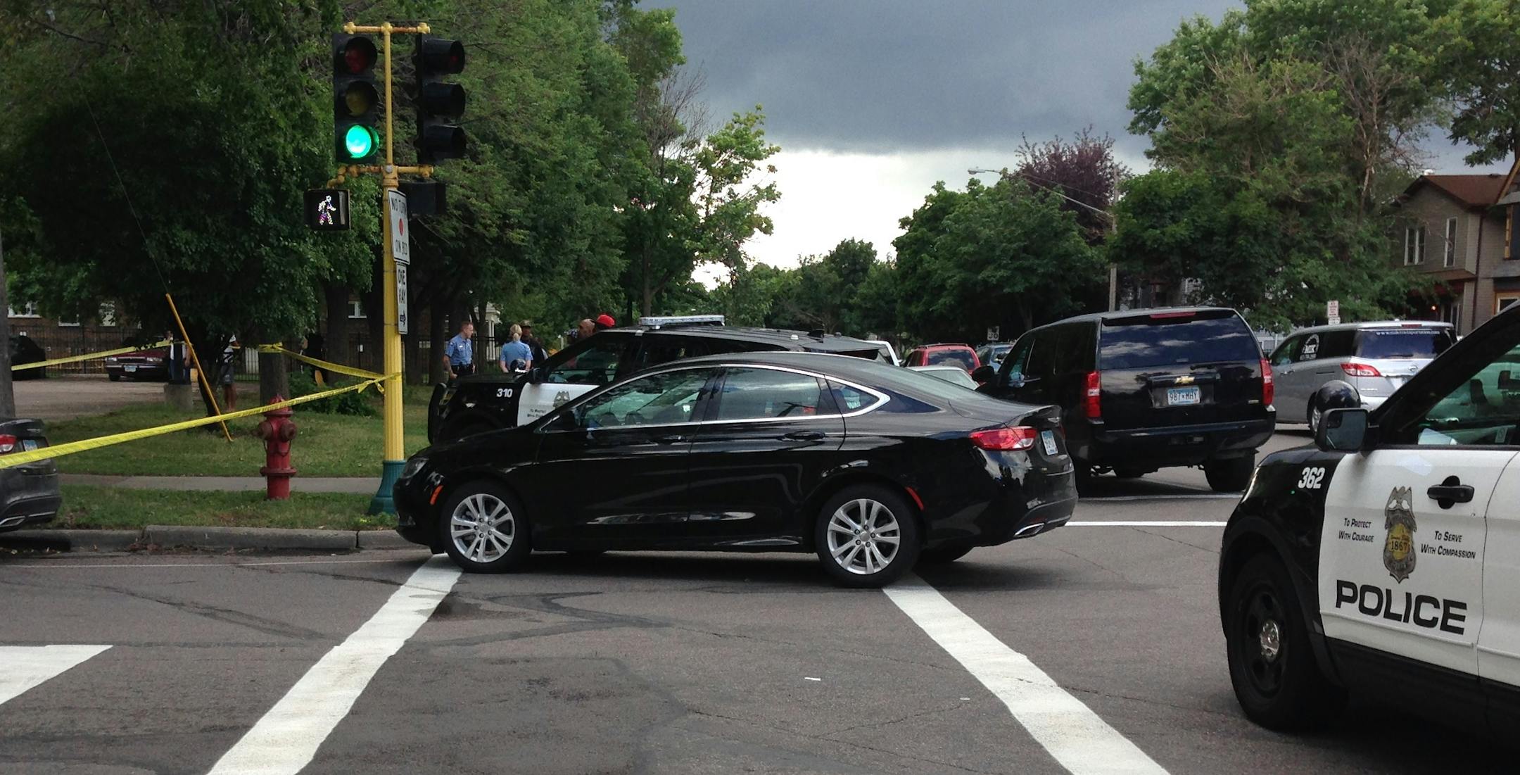 Police on the scene where a man was shot to death Thursday morning in south Minneapolis near E. 24th Street and Oakland Avenue S.