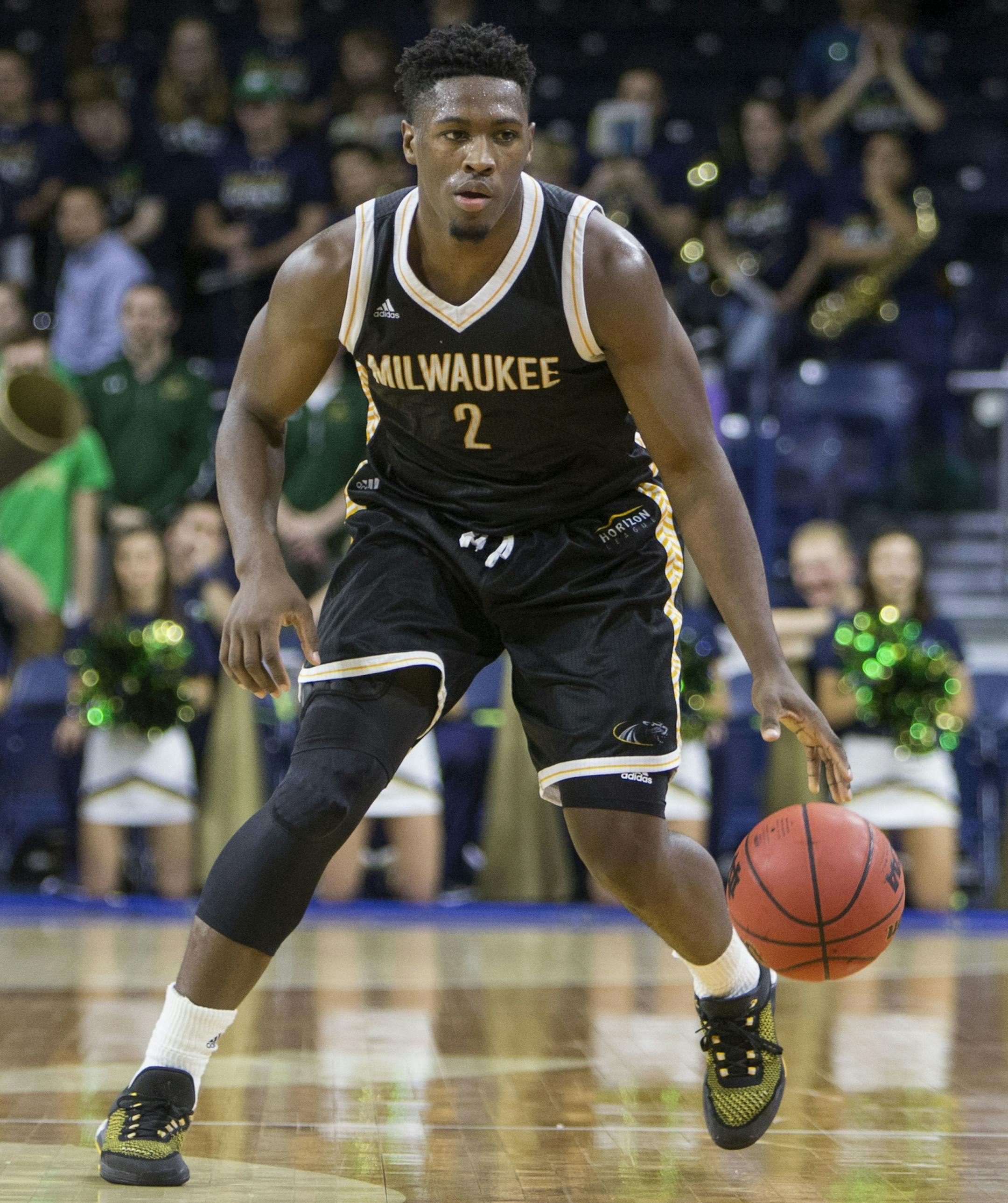 FILE - In this Nov. 17, 2015, file photo, Milwaukeeís Akeem†Springs (2) moves the ball down court during the second half of an NCAA college basketball game in South Bend, Ind. Springs has joined Minnesota this season as a graduate transfer. The Gophers on Tuesday, April 19, 2016, announced the addition of Springs, who will be eligible to play immediately as a senior and is on track for a degree at Milwaukee. (AP Photo/Robert Franklin, File0 ORG XMIT: NY174