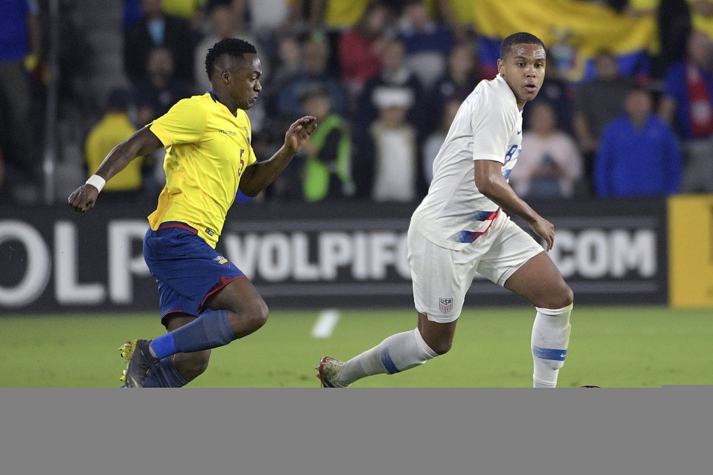 United States midfielder Weston McKennie (8) controls the ball in front of Ecuador midfielder Renato Ibarra (5) during the first half of an international friendly soccer match Thursday, March 21, 2019, in Orlando, Fla. (AP Photo/Phelan M. Ebenhack)