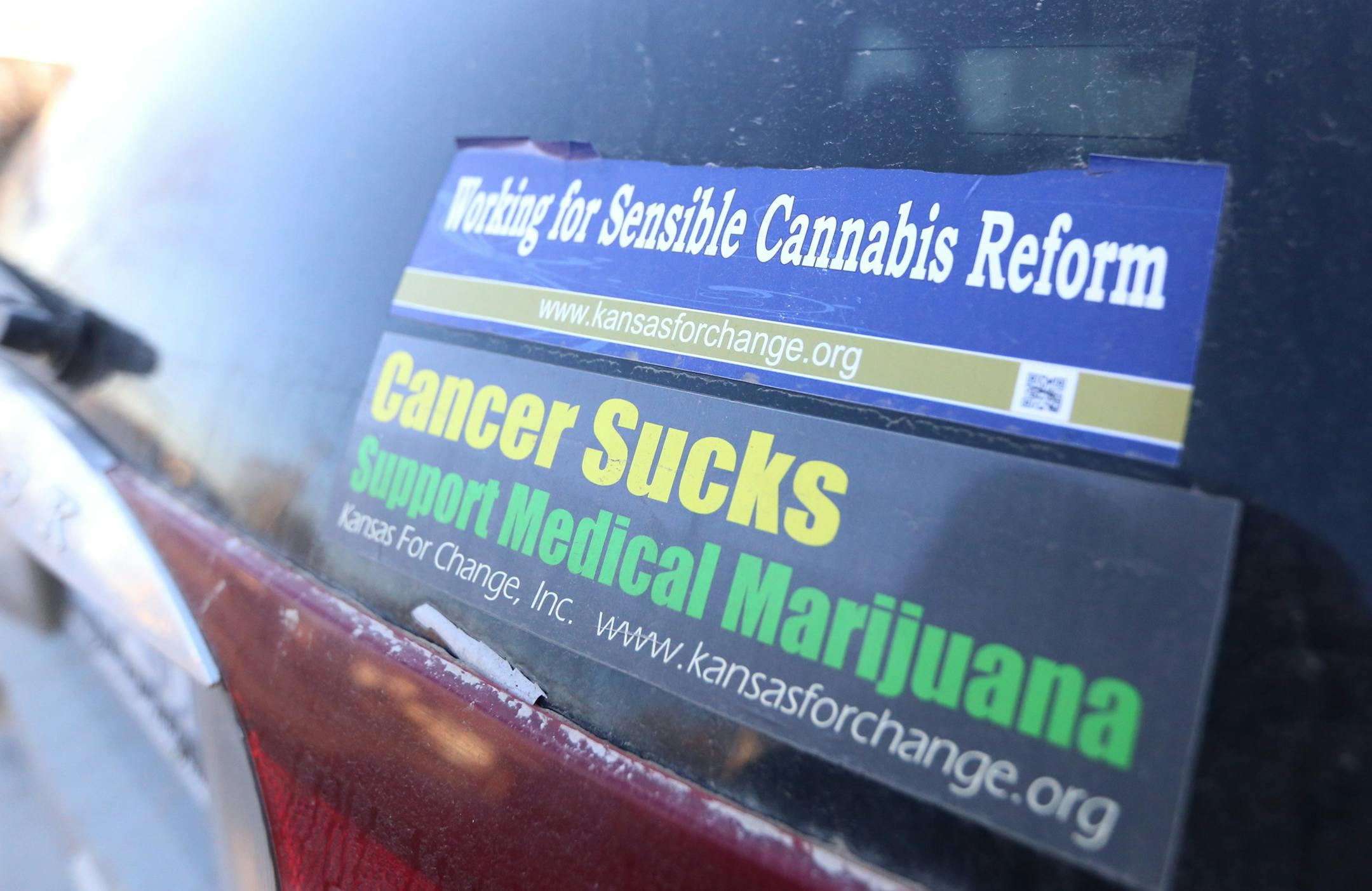 ADVANCE FOR THE WEEKEND OF JAN 18-19 AND THEREAFTER - In a Jan. 10, 2014 photo, stickers on David Mulfor's car support the use of medical marijuana. Mulford, has usesd marijuana oils to relieve a long list of physical ailments. He is a supporter of legalizing marijuana in Kansas.(AP Photo/The Wichita Eagle, Bo Rader)