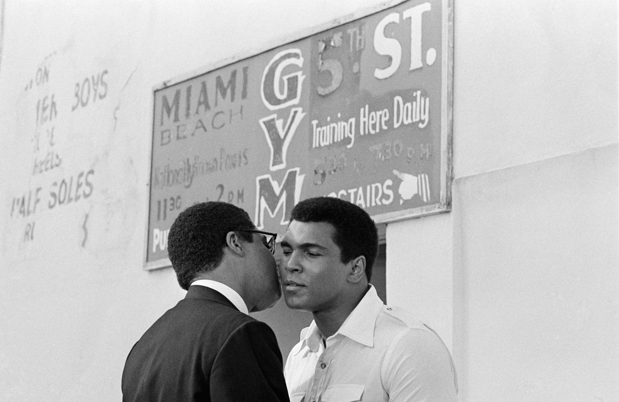 Muhammad Ali does a cheek to cheek goodbye to actor James Earl Jones in a scene in which Jones portrays Malcone X in the movie ?The Greatest?. The movie, which is being filmed at Miami Beach on Oct. 12, 1976 in Florida, especially the 5th St. Gym, is based on the life of Muhammad Ali. (AP Photo/Phil Sandlin) ORG XMIT: APHS285060