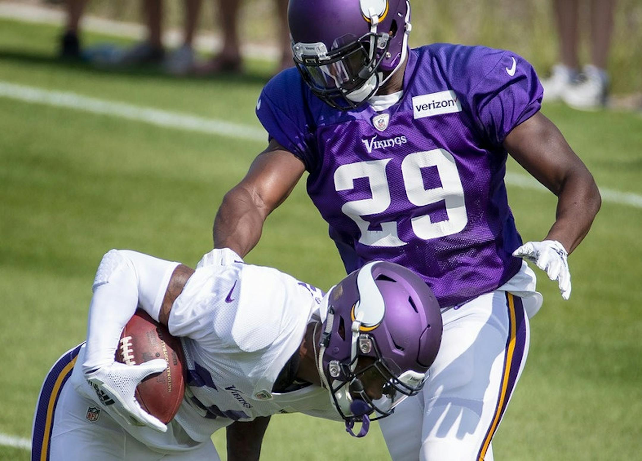 Stefon Diggs caught a pass in the end zone while being defended by Xavier Rhodes during a workout on July 30.