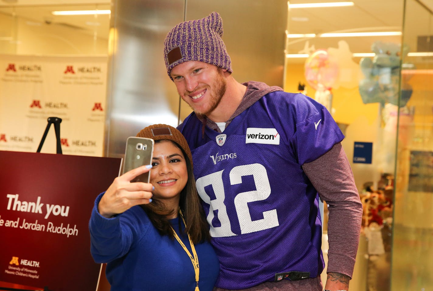 Vikings Kyle Rudolph along with other players visit with families at Children&#xed;s Hospital.