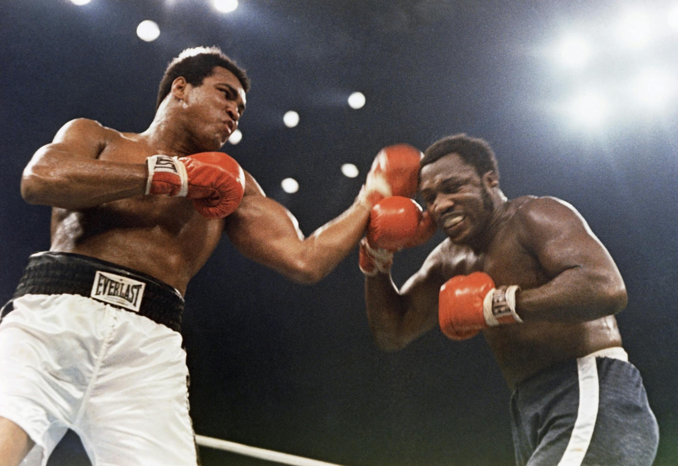 Muhammad Ali, left, and Joe Frazier are shown in action in the 12-round non-title fight that took place at Madison Square Garden in New York, Jan. 28, 1974. (AP Photo) ORG XMIT: APHS302272