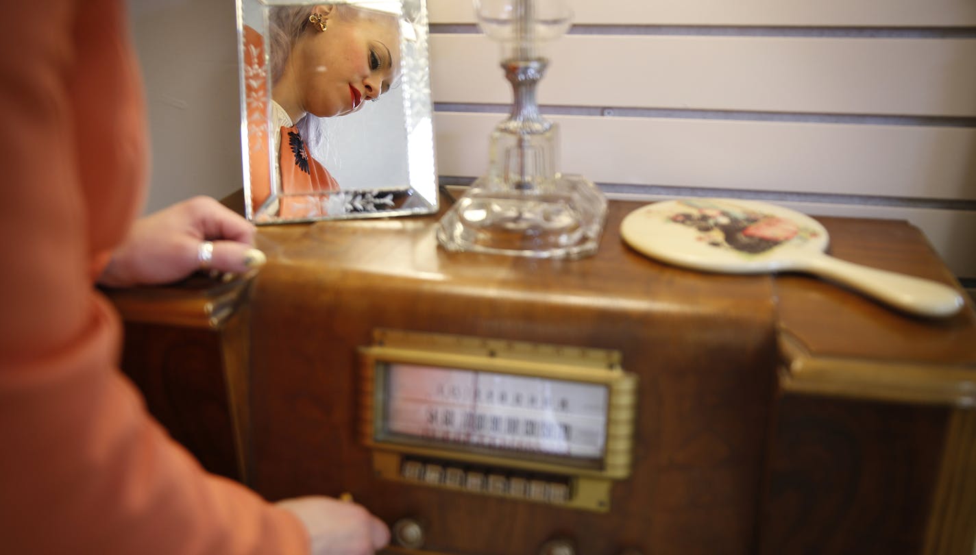 Owner Nikolina Erickson-Gunther changes the station on a vintage radio at Andrea's Vintage Bridal in Minneapolis. ] LEILA NAVIDI leila.navidi@startribune.com / BACKGROUND INFORMATION: Monday, November 17, 2014.