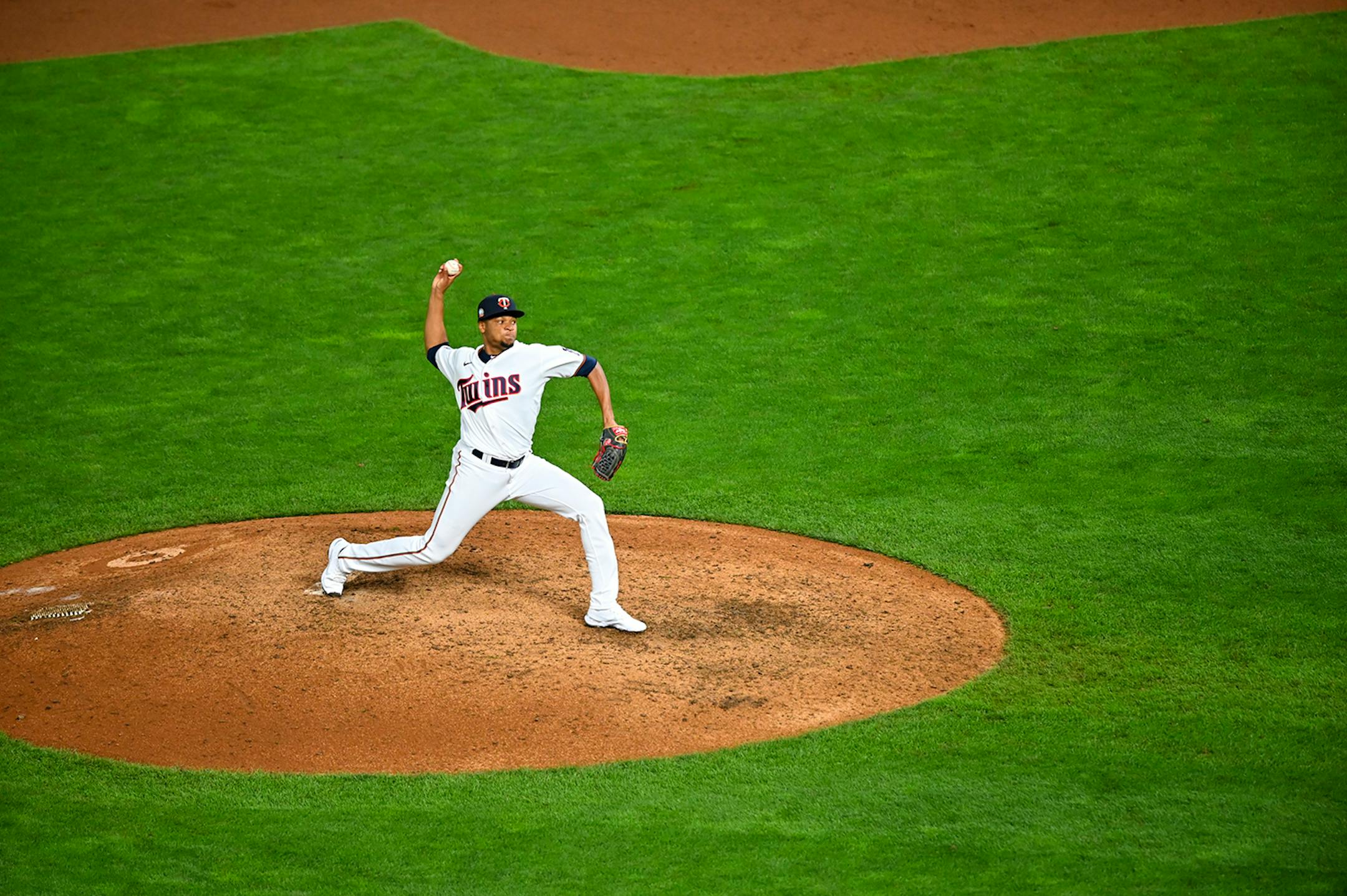 Minnesota Twins relief pitcher Jorge Alcala (66) threw a pitch in the top of the 11th against the Milwaukee Brewers.