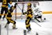 Michigan's Ethan Edwards (73) celebrates alongside teammate Dylan Duke after scoring past Michigan State goaltender Trey Augustine during the second p