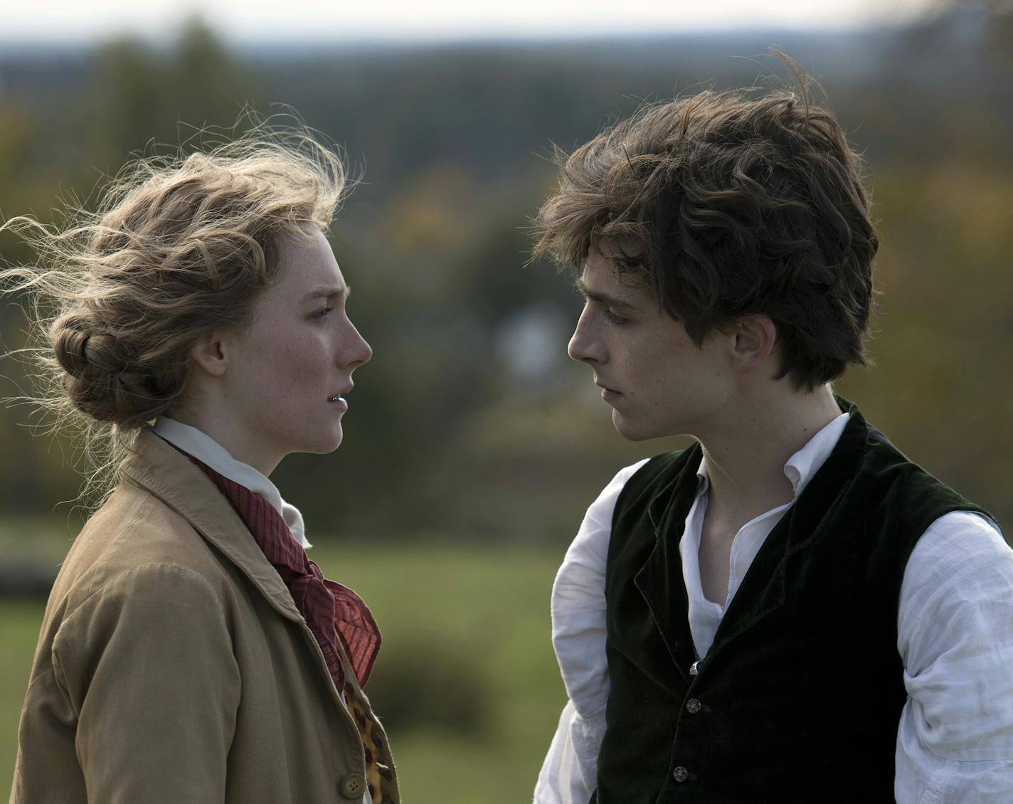 This image released by Sony Pictures shows, Saoirse Ronan and Timoth&#xe9;e Chalamet in a scene from "Little Women." On Monday, Dec. 9, 2019, Ronan was nominated for a Golden Globe for best actress in a motion picture drama for her role in the film. (Wilson Webb/Sony Pictures via AP)