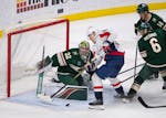 Wild goaltender Filip Gustavsson (32) denied Capitals right wing Nicolas Aube-Kubel (96) in the third period Tuesday at Xcel Energy Center.