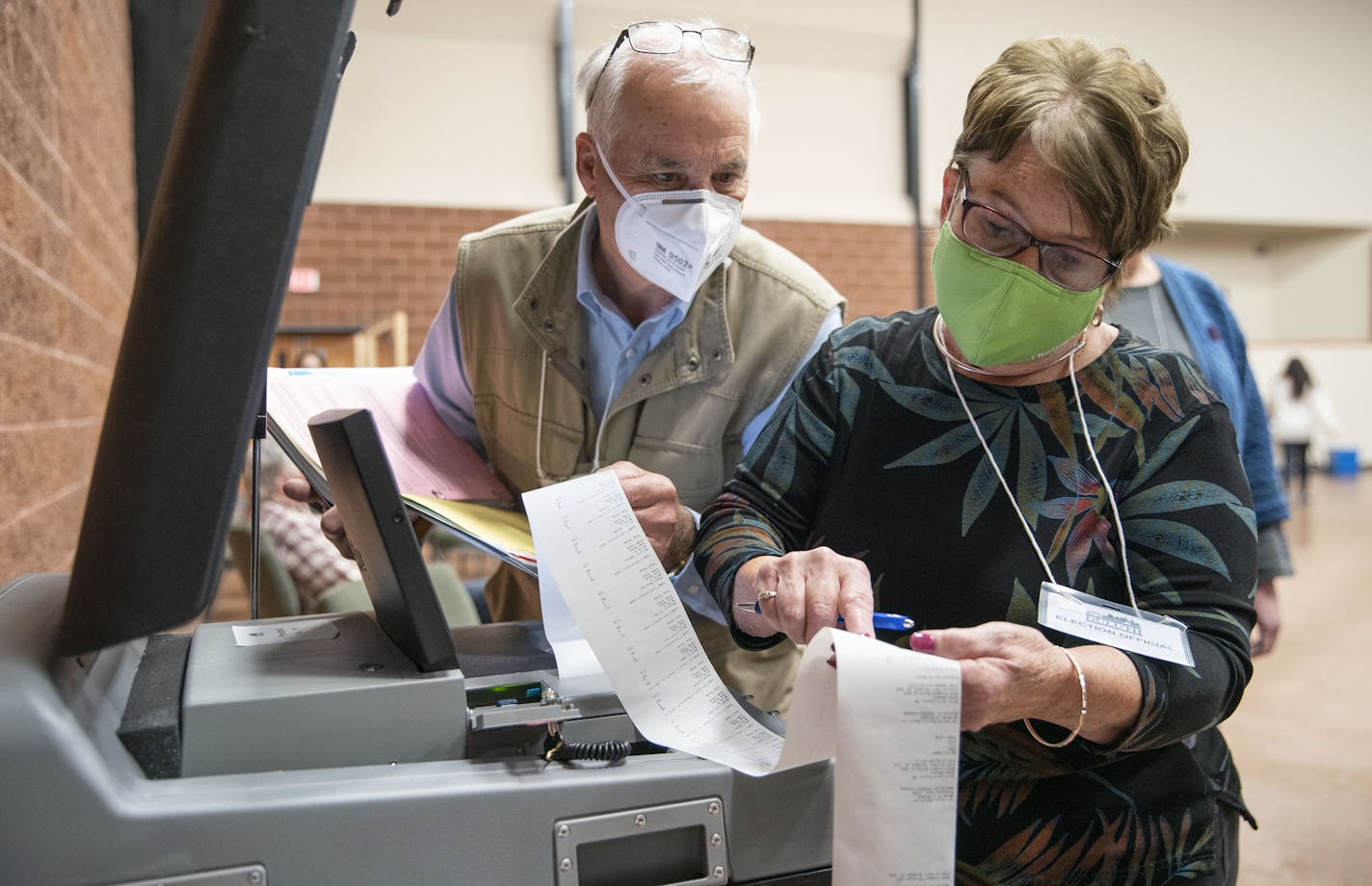 Duluth's 11th precinct co-head polling judges John Keenan and Kathie Trotta read off the in-person ballot counts for the presidential and U.S. Senate races to an Associated Press stringer after the polls closed Tuesday.