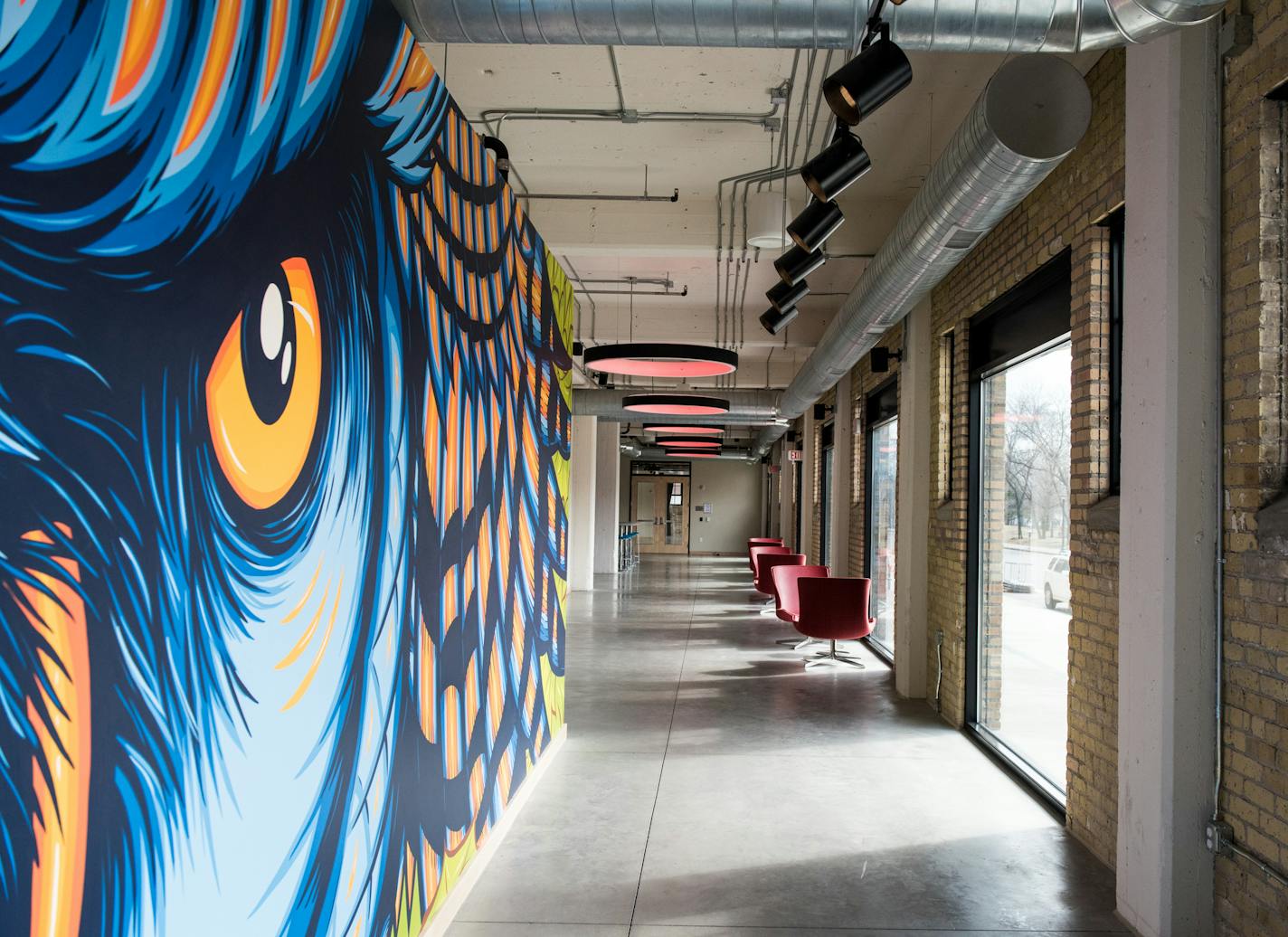 The front lobby, gathering and studio space inside the A-Mill Artist Lofts. The 1881 Pillsbury A-Mill was converted into affordable rental housing for artists.