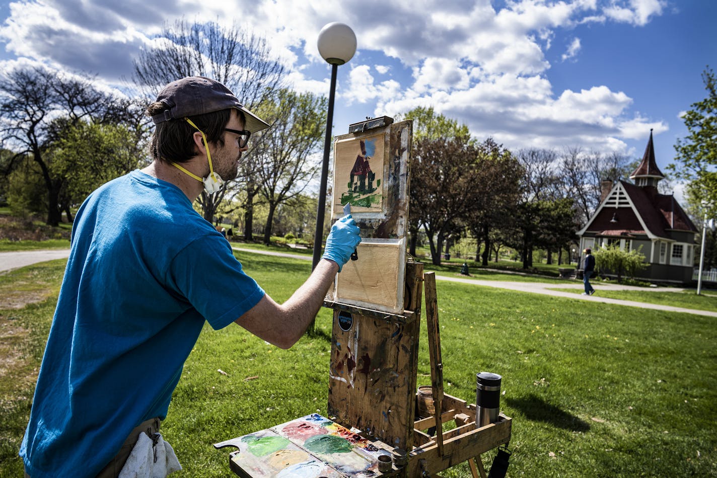 Palette knife in hand, and face mask at the ready, plein-air painter Jacob Docksey worked on a small painting of the 1906-vintage Loring Community Arts Center in downtown Minneapolis.