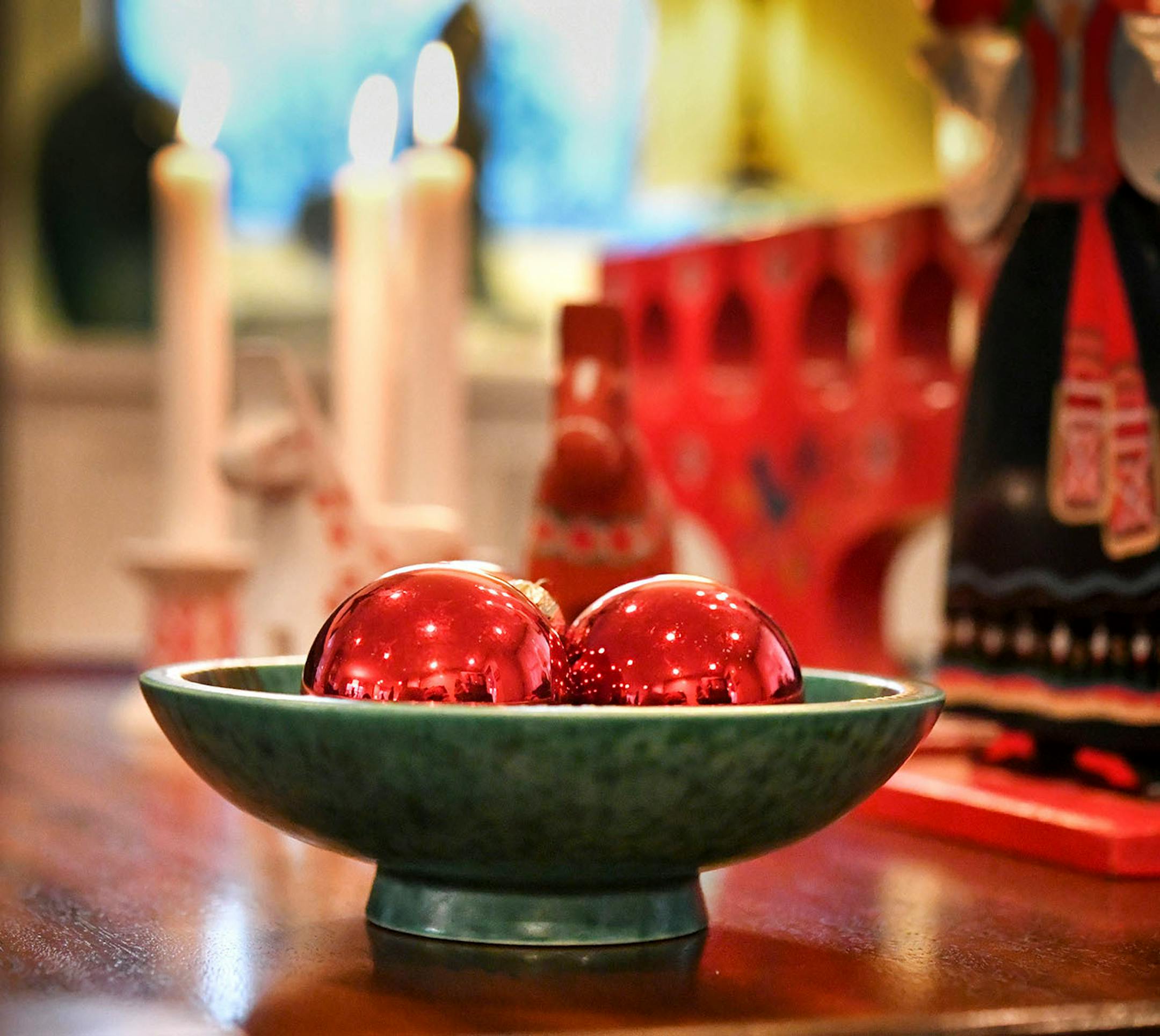 Add an unexpected contrasting detail, such as the green ceramic bowl from Sweden.