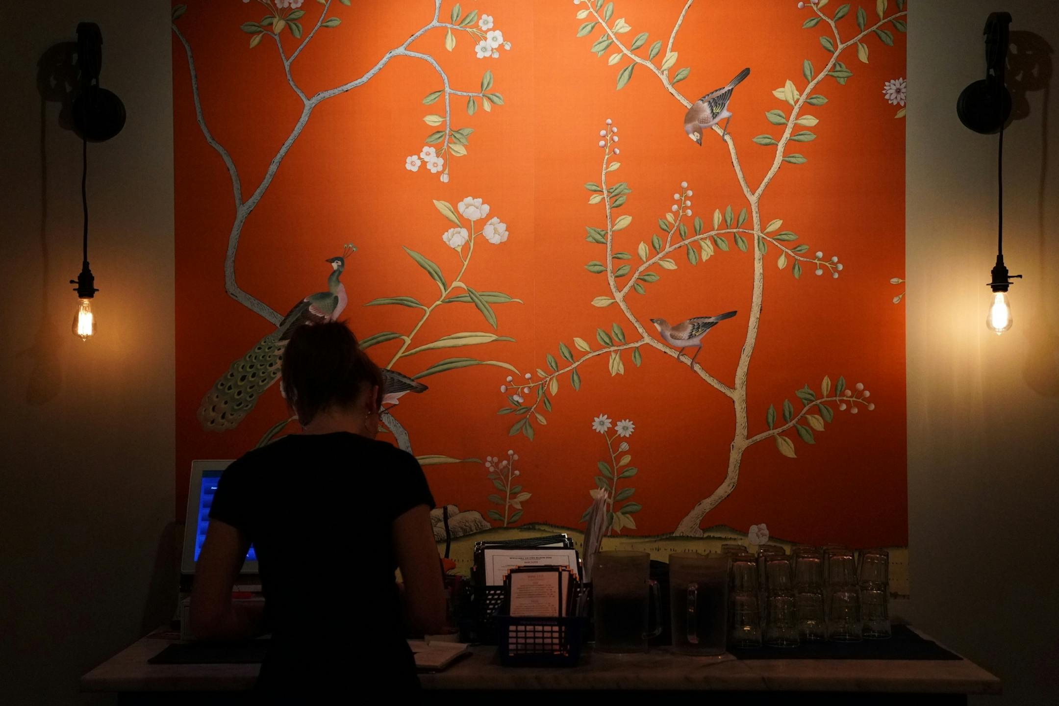 Server Eva Krohnfeldt rang up an order Saturday evening at the Black Dog Cafe.