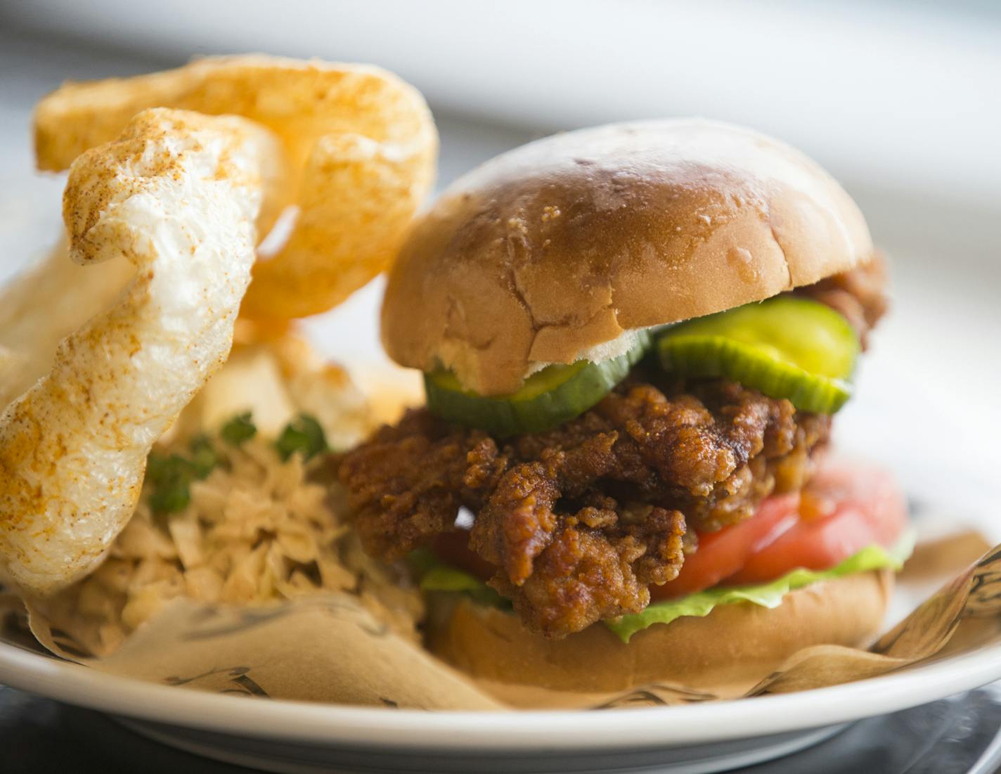 The fried chicken sandwich from Revival, one of their menu items that will be available at U.S. Bank Stadium. ] (Leila Navidi/Star Tribune) leila.navidi@startribune.com BACKGROUND INFORMATION: Officials with the Minnesota Vikings, the Minnesota Sports Facilities Authority and Aramark announce some of the local culinary partners that will be featured at U.S. Bank Stadium during a press conference on Tuesday, May 24, 2016.