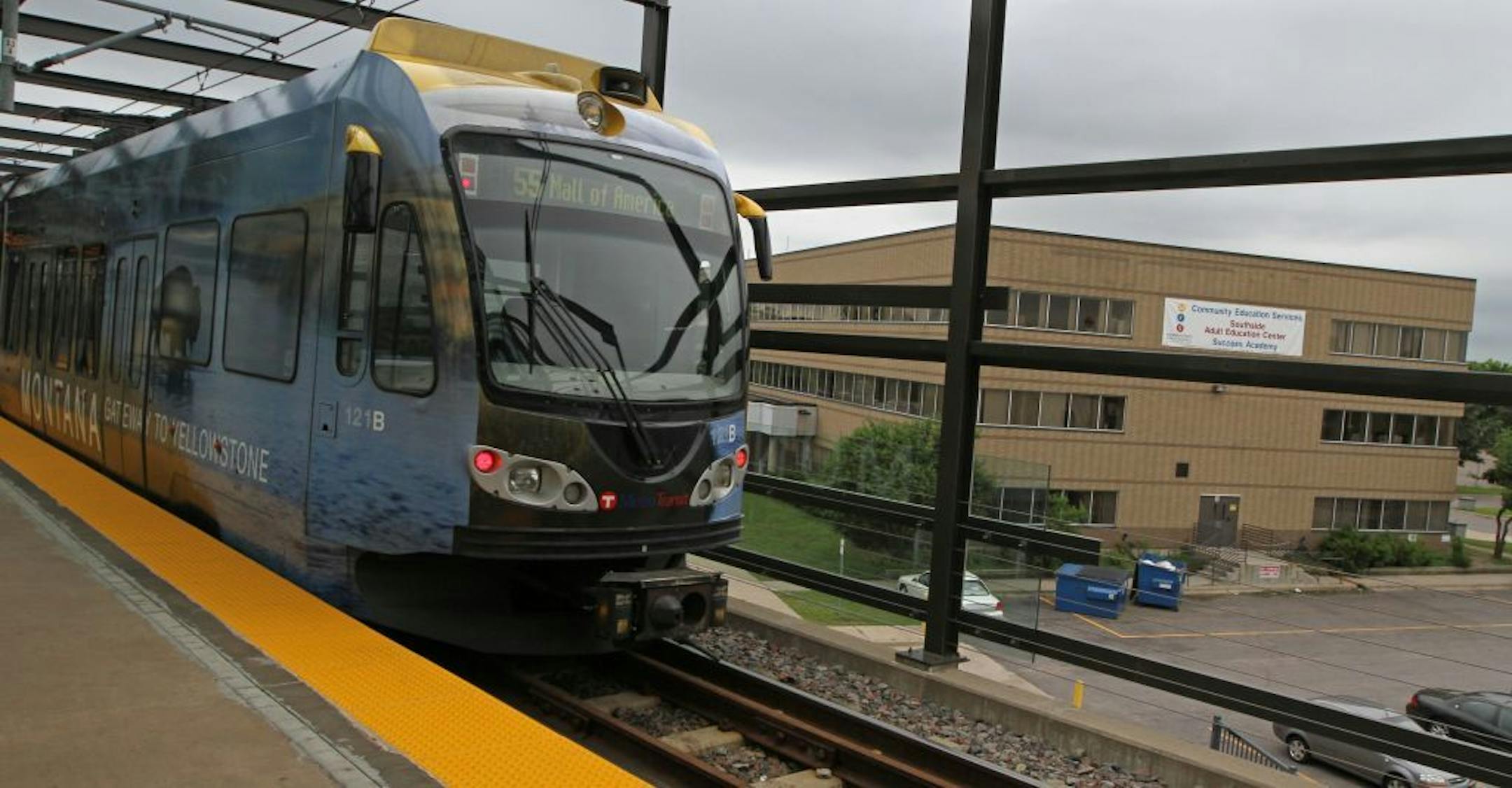A southbound light rail train pulled out of the Lake Street station that overlooks the old Brown Institute building at 2225 East Lake Street on 6/20/12. The buidling now houses the Community Education Services Southside Adult Education Center.