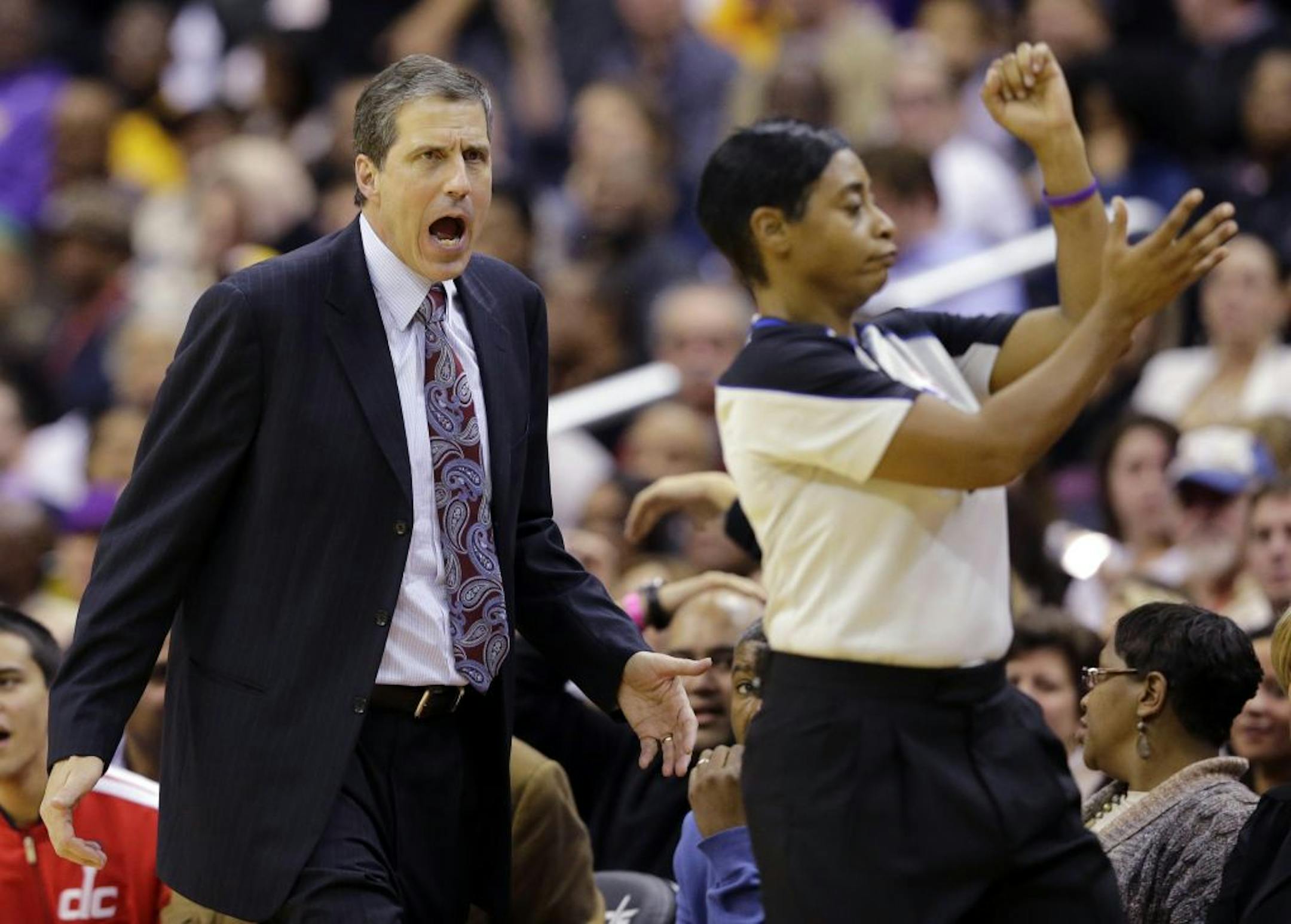 Washington Wizards head coach Randy Wittman protests a foul call with referee Violet Palmer in the second half of an NBA basketball game against the Los Angeles Lakers Friday, Dec. 14, 2012 in Washington. The Lakers won 102-96.