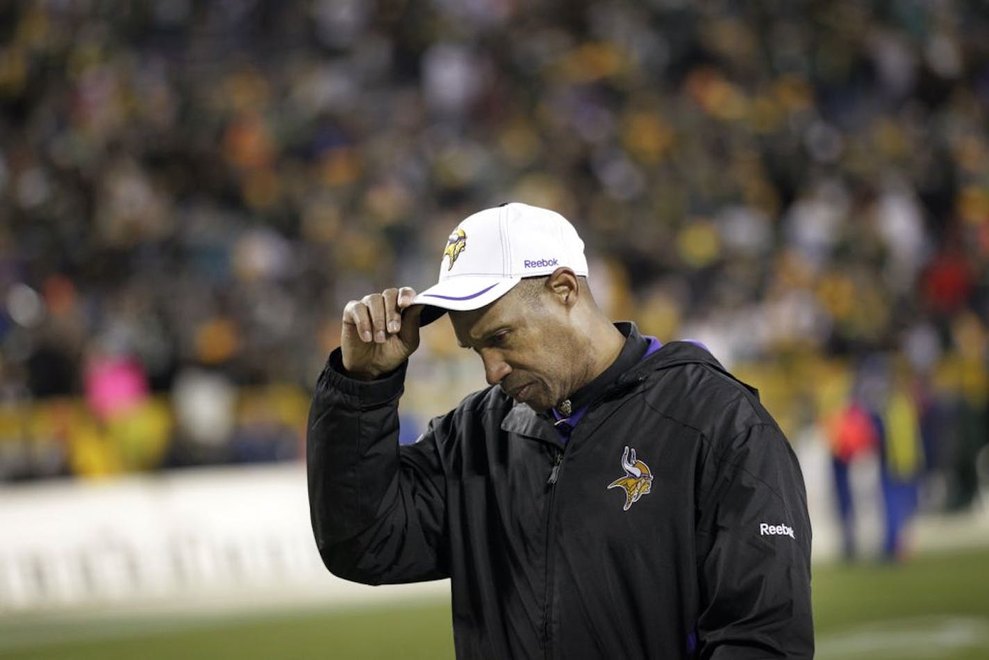 Minnesota Vikings head coach Leslie Frazier walk of the field at end of the game against the Green Bay Packers, The Packers beat the Vikings, 45-7, at Lambeau Field in Green Bay, Wisconsin, Monday, November 14, 2011.