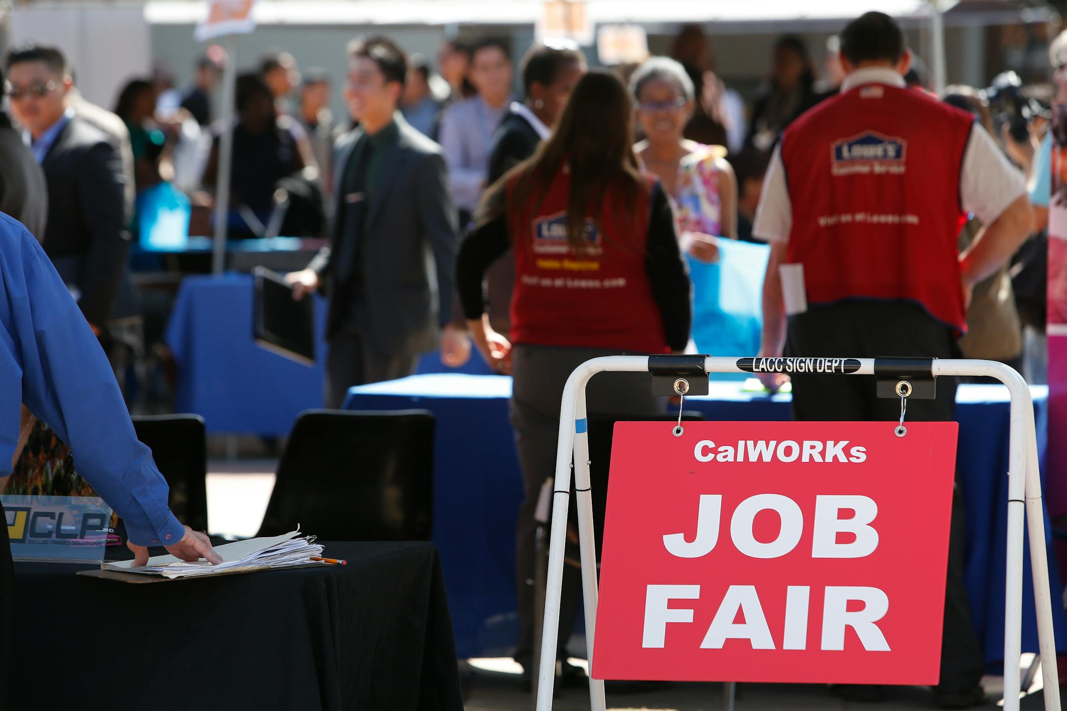 CalWORKs Job Fair signage is displayed during the Fall Classic Hiring Spree event at Los Angeles City College in Los Angeles, U.S., on Thursday, Oct. 10, 2013. Economists and policy-makers have been trying to understand the reason for the prolonged period of high unemployment in the U.S.: a skills mismatch, weak aggregate demand, or wage rigidities. Photographer: Patrick T. Fallon/Bloomberg