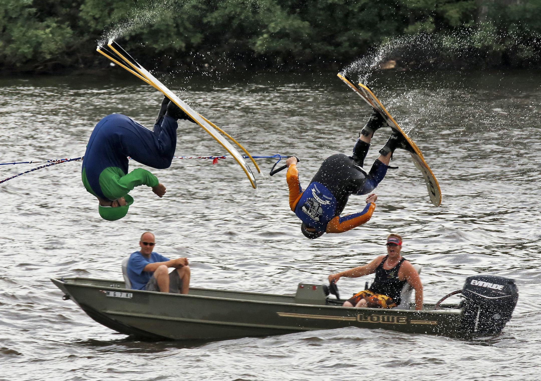 The Twin Cities River Rats Ski Team performed a 'Super Mario World' water ski show on the Mississippi River in downtown Minneapolis Saturday. Towering pyramids, ramp jumpers and barefoot skiers were all part of the program free to the public. Mario characters Abe Cass, left, and Jeremy Tummel performed a series of flips as a rescue boat floated alongside. (MARLIN LEVISON/STARTRIBUNE(mlevison@startribune.com