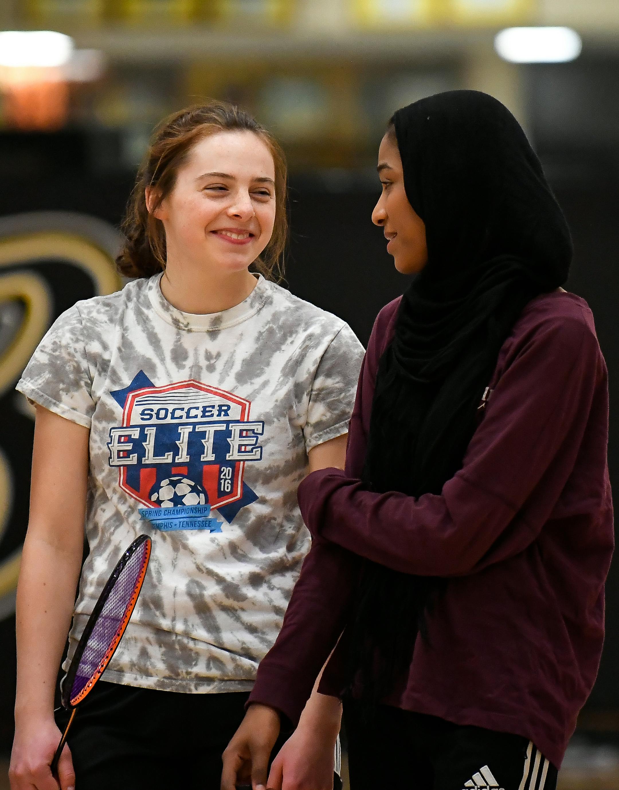 Burnsville's Rachel Waterman and Nawal Abdiwahed shared a laugh during badminton practice Friday. ] AARON LAVINSKY &#xef; aaron.lavinsky@startribune.com South zone feature on the diversity of Burnsville High School's badminton team photographed Friday, April 6, 2018.