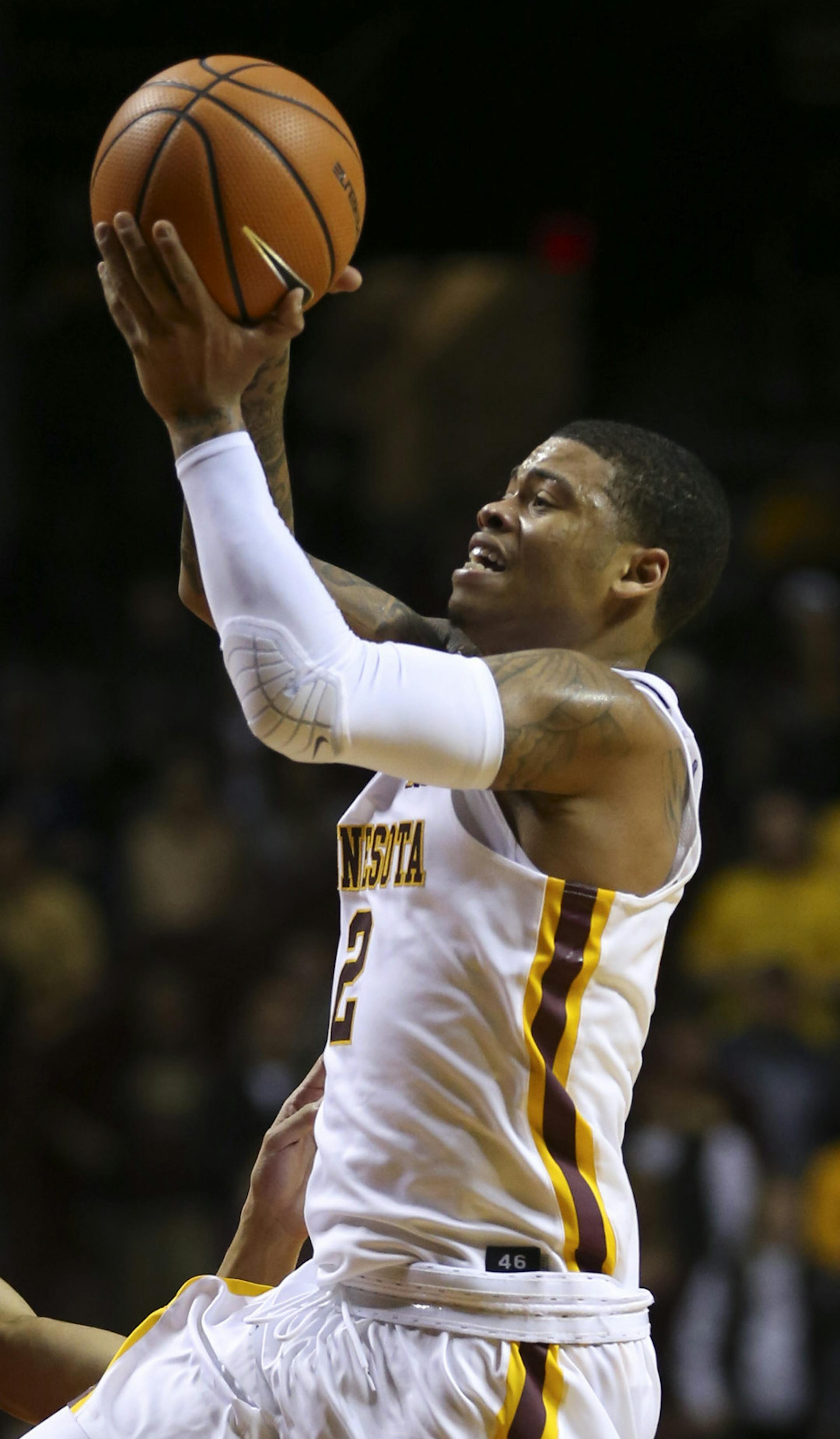 Minnesota Gophers guard Nate Mason (2) shot as he drove past Rutgers guard Geo Baker (0) in the second half. Mason finished with 26 points. ] JEFF WHEELER ï jeff.wheeler@startribune.com The University of Minnesota men's basketball team defeated Rutgers 89-67 in their Big 10 conference opener Sunday evening, December 3, 2017 at Williams Arena in Minneapolis.
