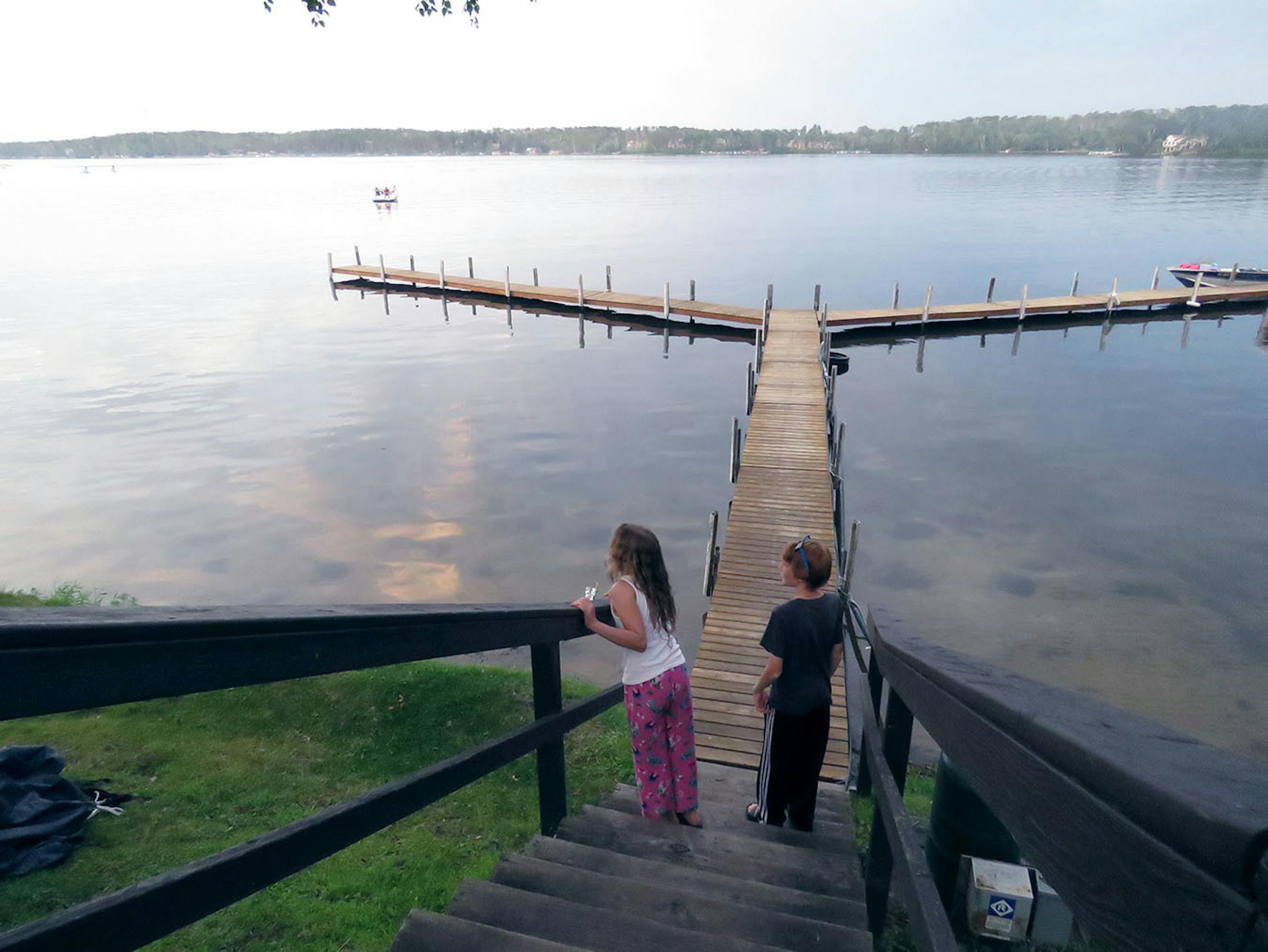 Kylie McClintick and new friend, Mitch Robertson of Mankato, check out the evening views of Gull Lake at Cragun's Resort before heading to the beach for a campfire and marshmallows.
