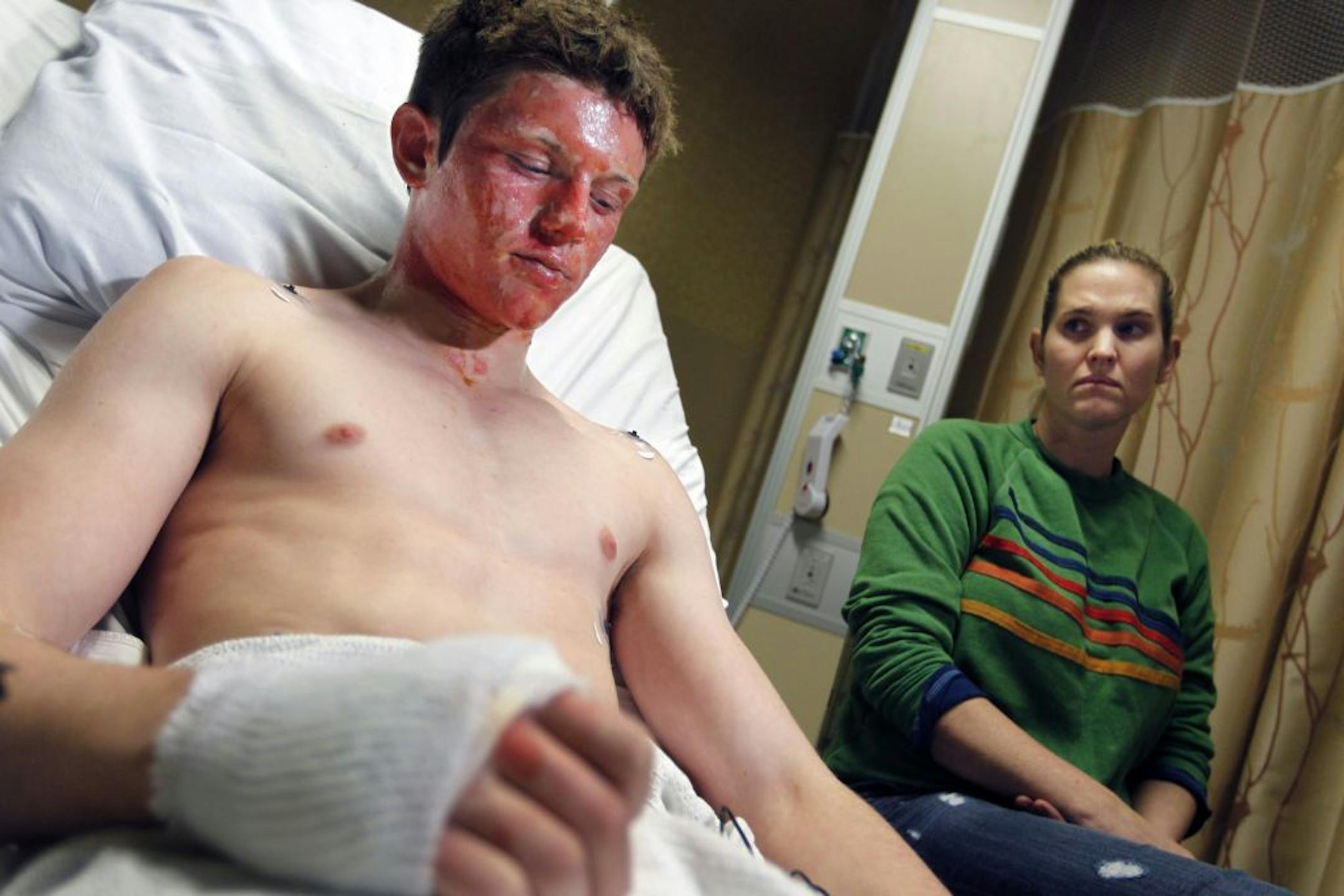 With his mother, Lisa, at his side at Hennepin County Medical Center, Dane Neuberger described what led to his burns Thursday at Maple Grove Junior High.