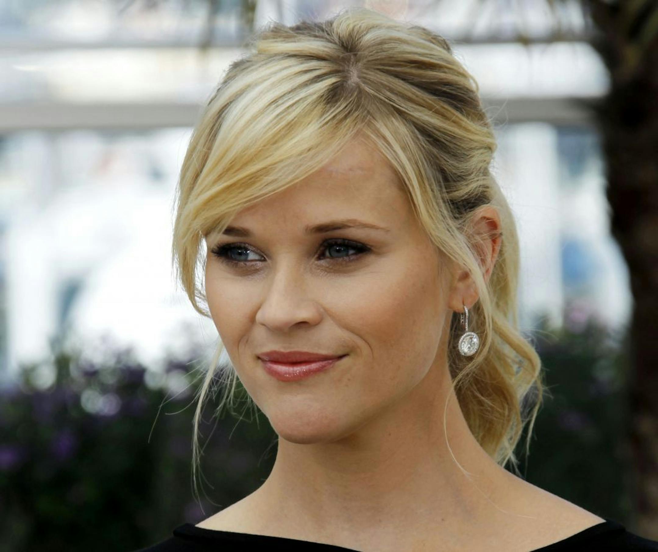 FILE - This May 26, 2012 file photo shows actress Reese Witherspoon posing during a photo call for Mud at the 65th international film festival, in Cannes, southern France. Witherspoon has given birth to her third child, naming him after a place close to her heart. Meredith O'Sullivan Wasson, Witherspoon's publicist, said Thursday that �Witherspoon and husband Jim Toth welcomed Tennessee James into their family today. Both mom and baby are healthy and the entire family is thrilled."