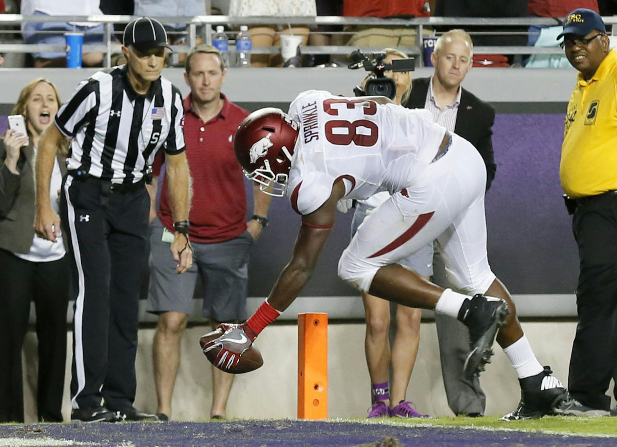 Arkansas football player Jeremy Sprinkle was suspended from Thursday's Belk Bowl after police said he shoplifted from the Belk department store, which gave players gift cards to spend at the store as a perk for playing in the game.