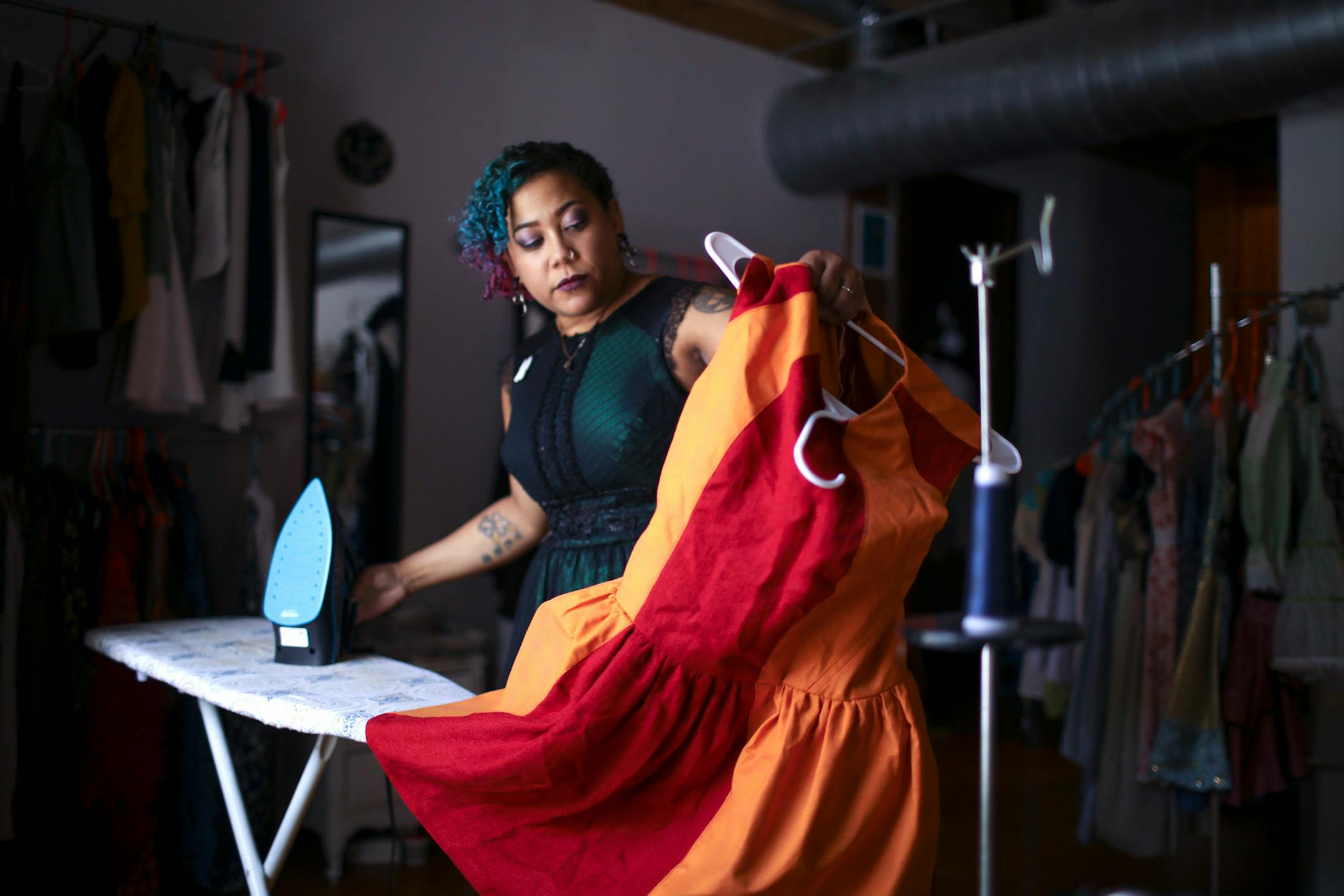Minneapolis designer Samantha Rei ironed a dress before placing it on display in her Minneapolis studio.