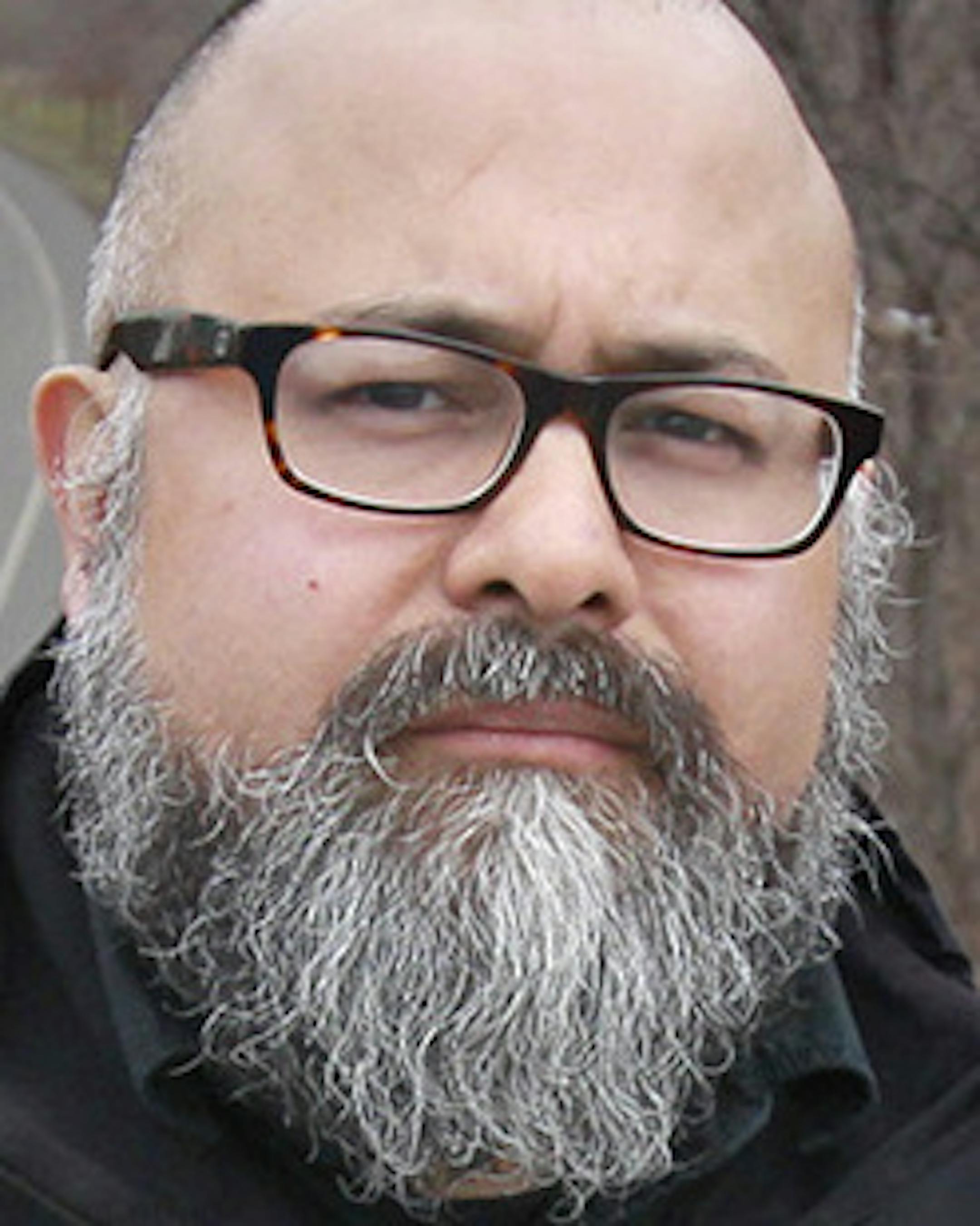 Jose Luis Villasenor, a Latino activist, hiked along the Midtown Greenway pointed out local industry he regards as noxious, such as a foundry and blacktop plant, Wednesday, March 18, 2015 in Minneapolis, MN. ] (ELIZABETH FLORES/STAR TRIBUNE) ELIZABETH FLORES • eflores@startribune.com