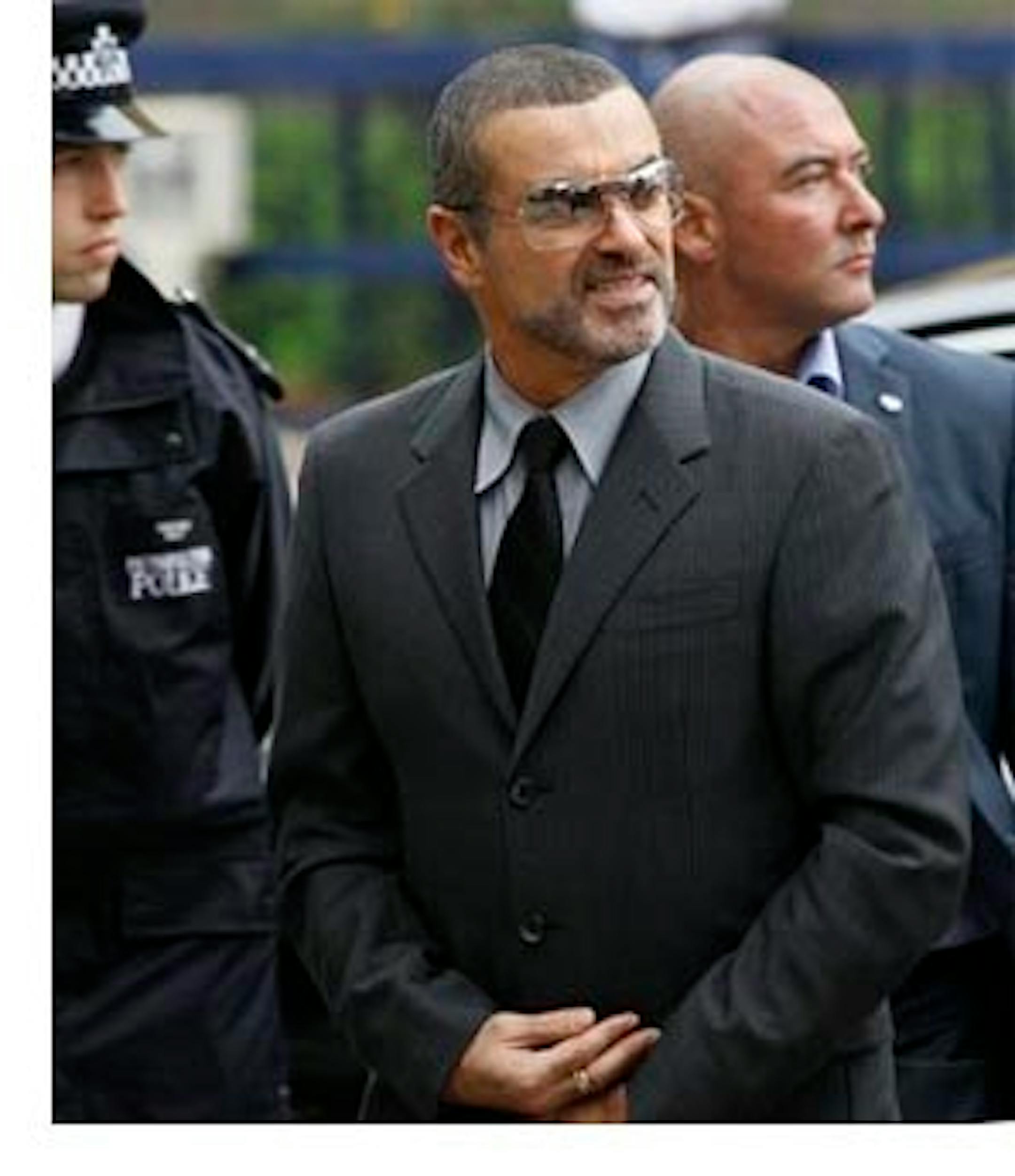 British singer George Michael arrives for sentencing at Highbury magistrates court in London, Tuesday, Sept. 14, 2010. George Michael is facing a fine or jail time after he admitted driving while under the influence of drugs. The singer pleaded guilty last month to driving under the influence and possession of cannabis following an incident on July 4 when his Range Rover crashed into a photo shop in north London.  (AP Photo/Kirsty Wigglesworth)