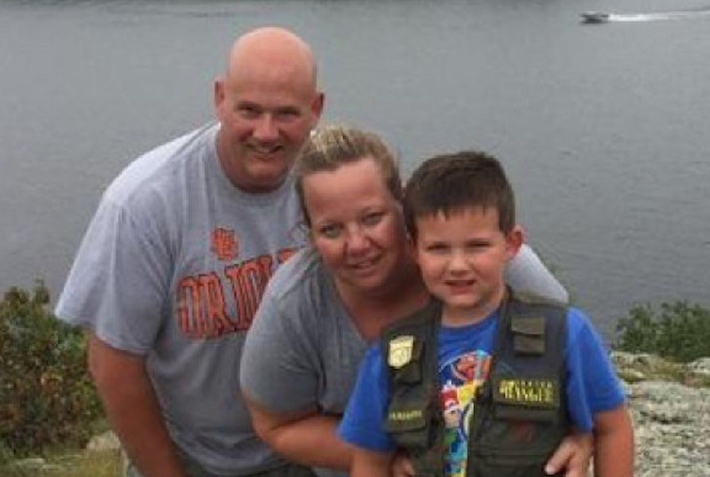 Wayzata officer William Mathews, with his wife and son.