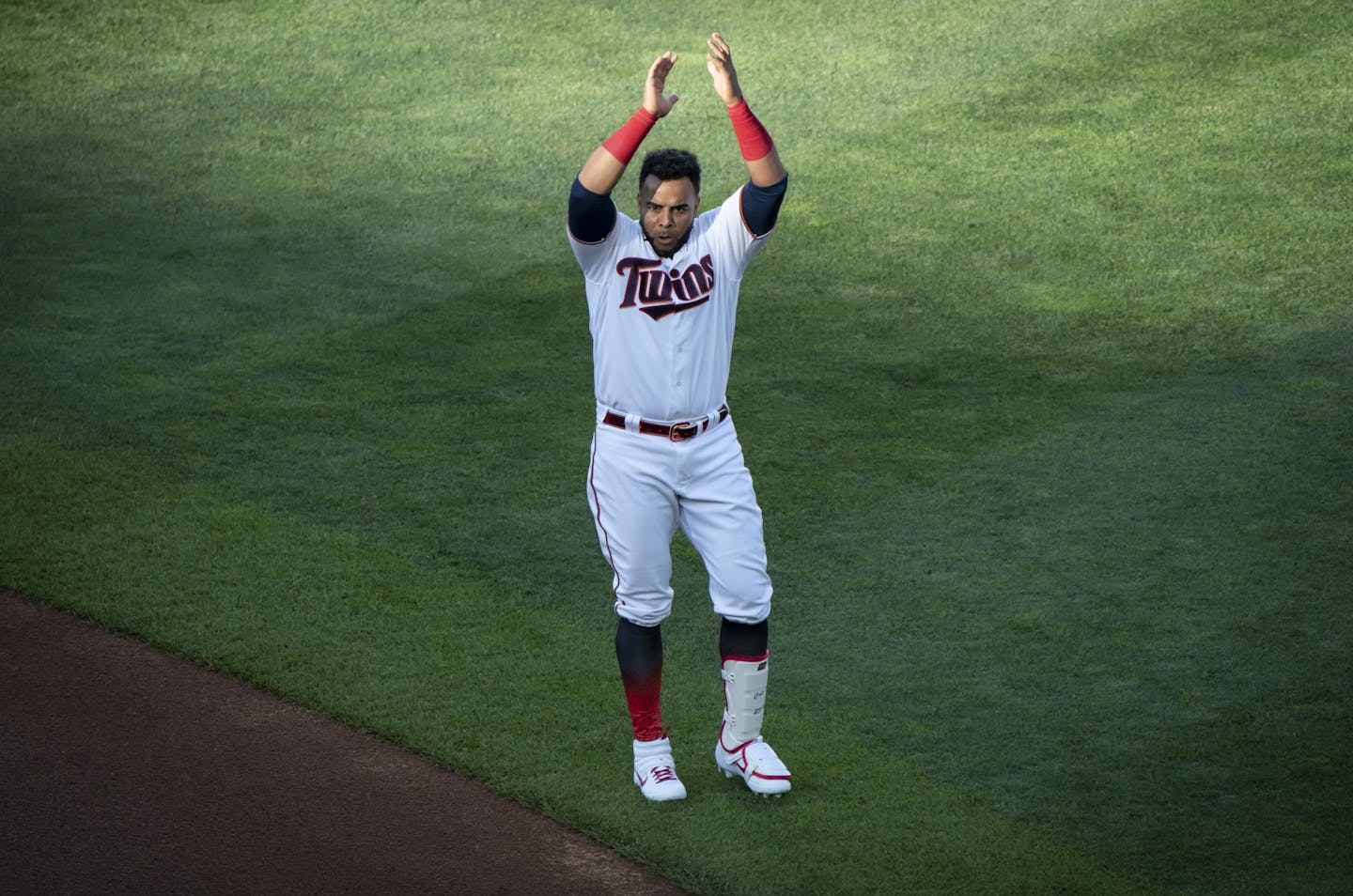 Nelson Cruz (23) clapped as the stadium played fake crowd sounds at the beginning of a scrimmage at practice at Target Field in Minneapolis, Minn., on Wednesday, July 15, 2020.