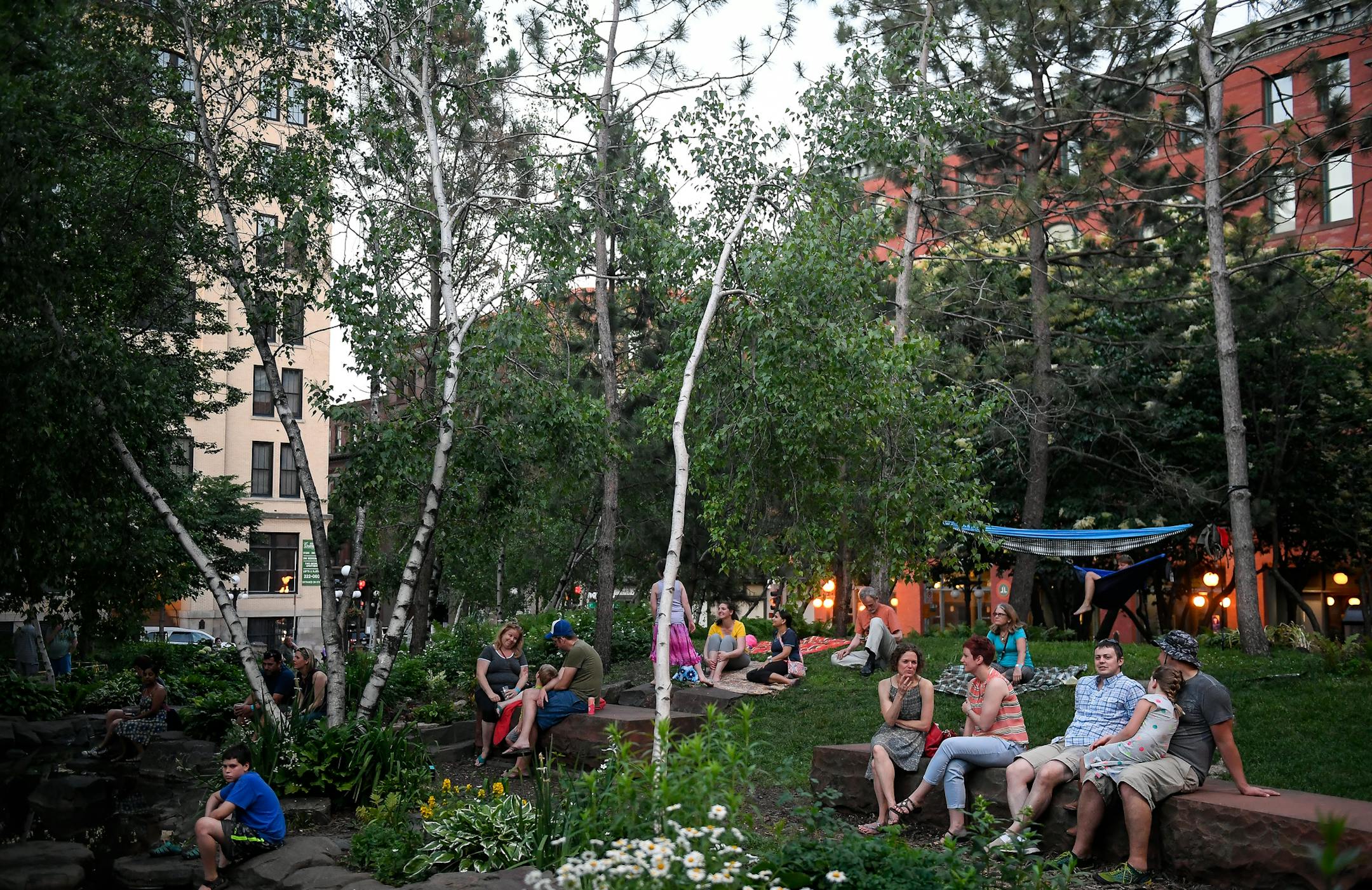 The scene at Mears Park Thursday night as live music was performed nearby. ] AARON LAVINSKY &#xef; aaron.lavinsky@startribune.com This decade is on track to be the first in 90 years that Minneapolis and St. Paul's share of the region's population will grow, versus shrink. It's a stunning shift from years of flat or declining population in the urban core, which has never kept pace with suburban growth in recent history. We photograph live music at Mears Park in St. Paul, on Thursday, June 15, 201