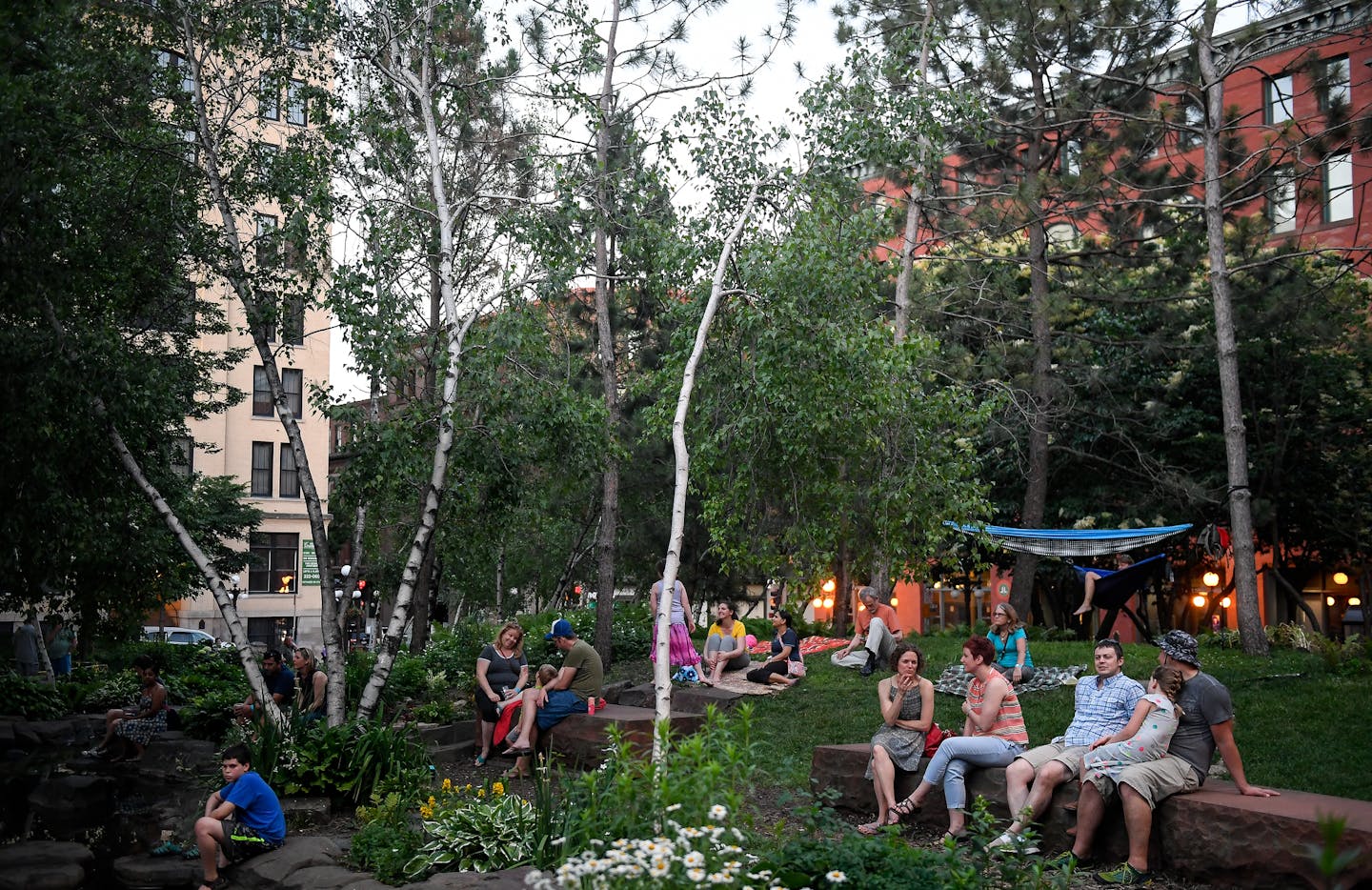 The scene at Mears Park Thursday night as live music was performed nearby. ] AARON LAVINSKY &#xef; aaron.lavinsky@startribune.com This decade is on track to be the first in 90 years that Minneapolis and St. Paul's share of the region's population will grow, versus shrink. It's a stunning shift from years of flat or declining population in the urban core, which has never kept pace with suburban growth in recent history. We photograph live music at Mears Park in St. Paul, on Thursday, June 15, 201