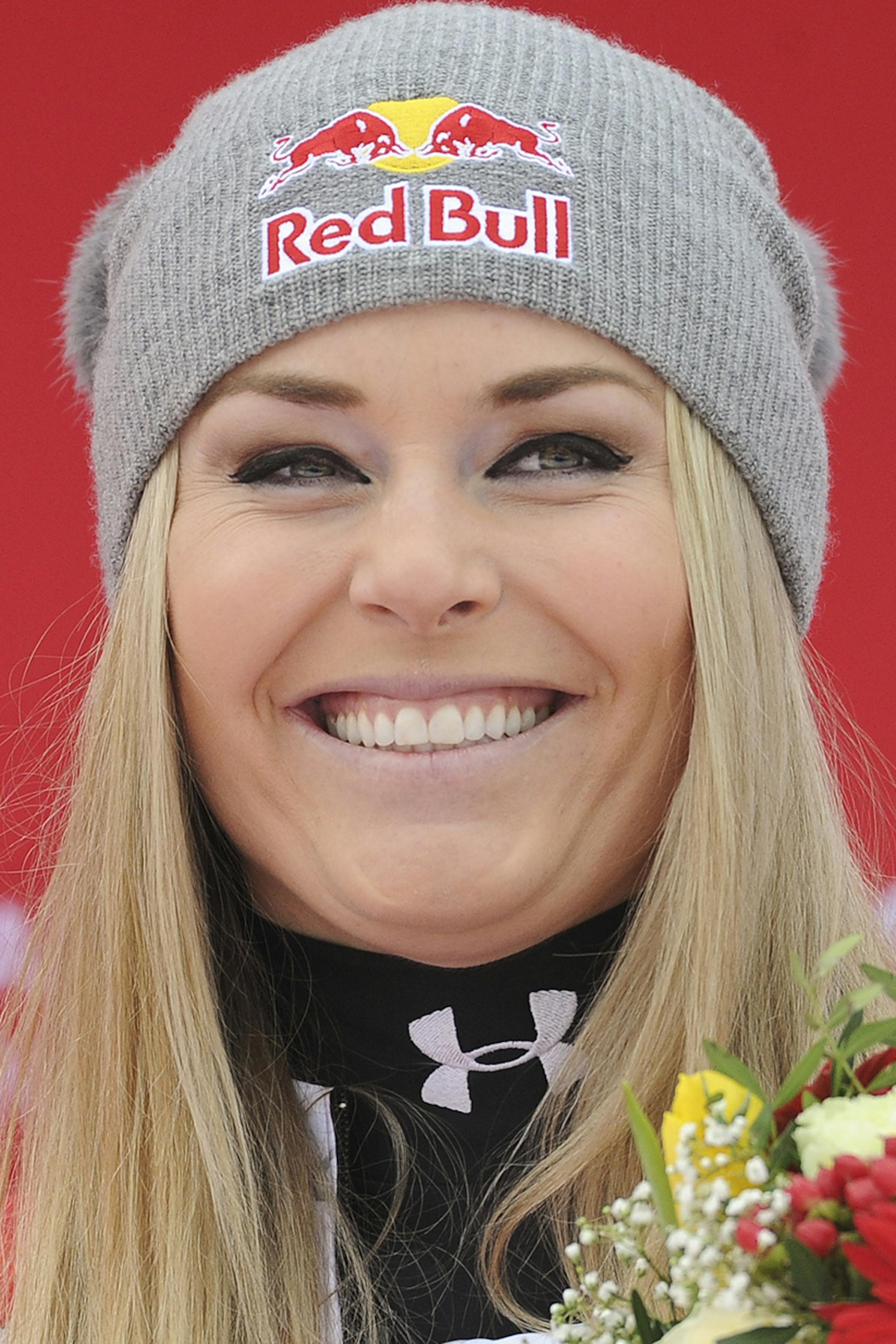 Lindsey Vonn smiles on the podium after winning an alpine ski, women's World Cup super-G, in Altenmarkt-Zauchensee, Austria, Sunday, Jan. 10, 2016. (AP Photo/Pier Marco Tacca) ORG XMIT: MIN2016011211453554
