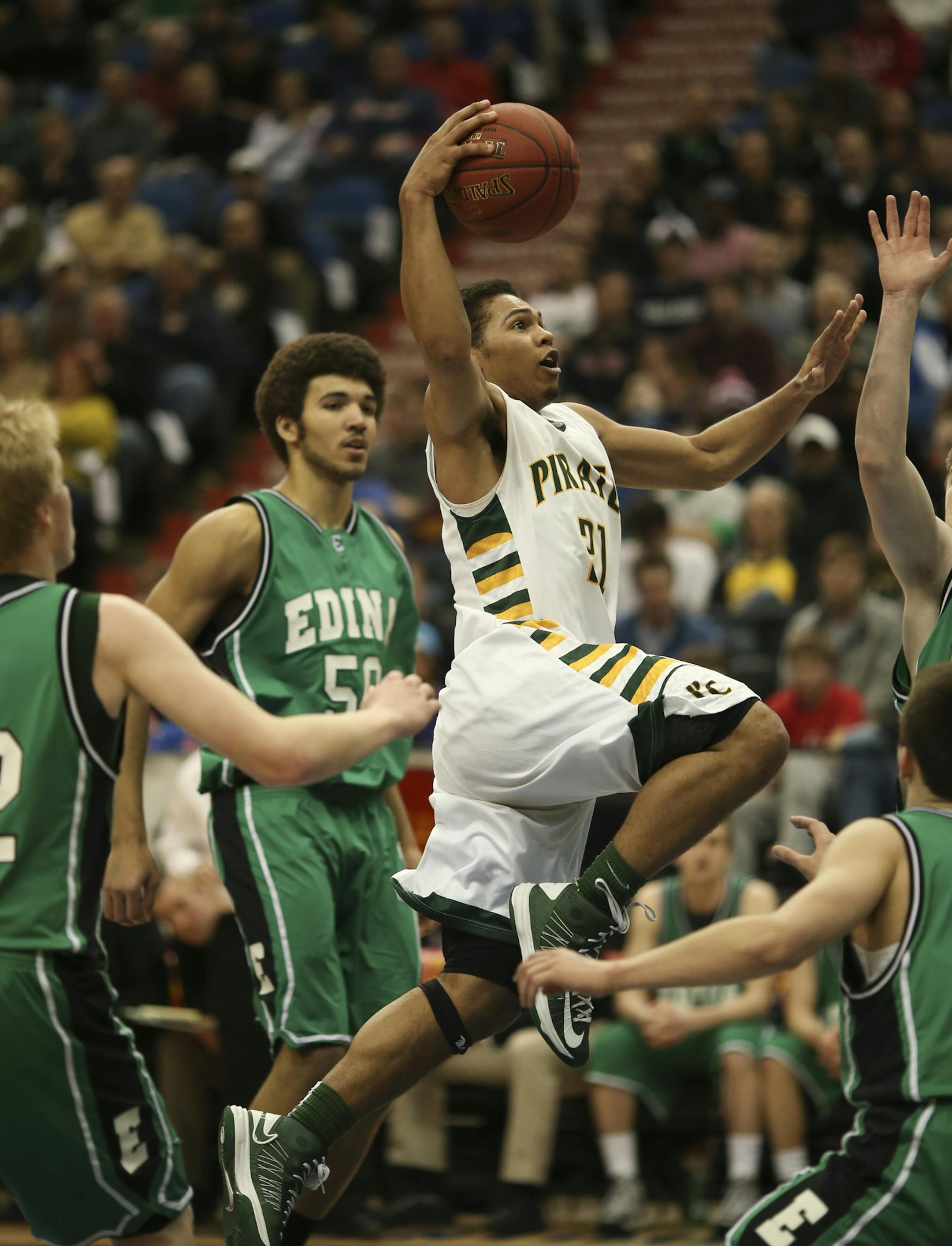 Park Center met Edina in a Class 4A Boys' Basketball State Tournament semifinal game Thursday night, March 21, 2013 at Target Center in Minneapolis. Park Center's Quinton Hooker drove through a swarm of Edina defenders to score two of his six first half points. ] JEFF WHEELER ‚Ä¢ jeff.wheeler@startribune.com