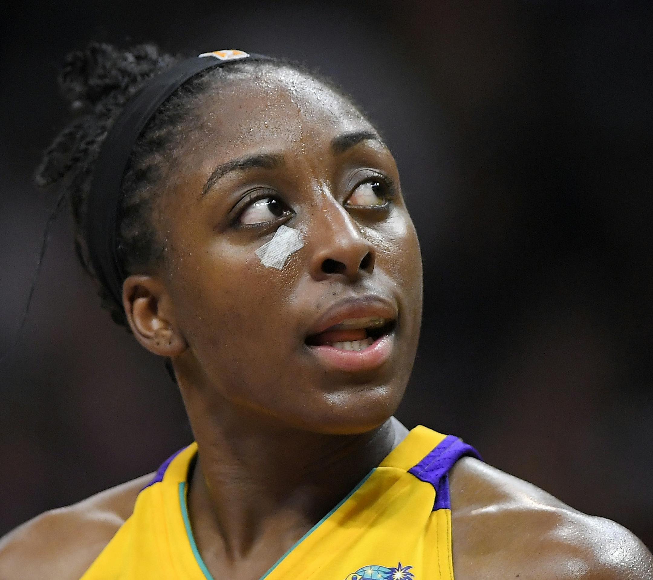 Los Angeles Sparks forward Nneka Ogwumike looks toward the scoreboard after receiving treatment for a cut on the face during the second half against the Minnesota Lynx in Game 3 of the WNBA basketball finals, Friday, Sept. 29, 2017, in Los Angeles. The Sparks won 75-64. (AP Photo/Mark J. Terrill)