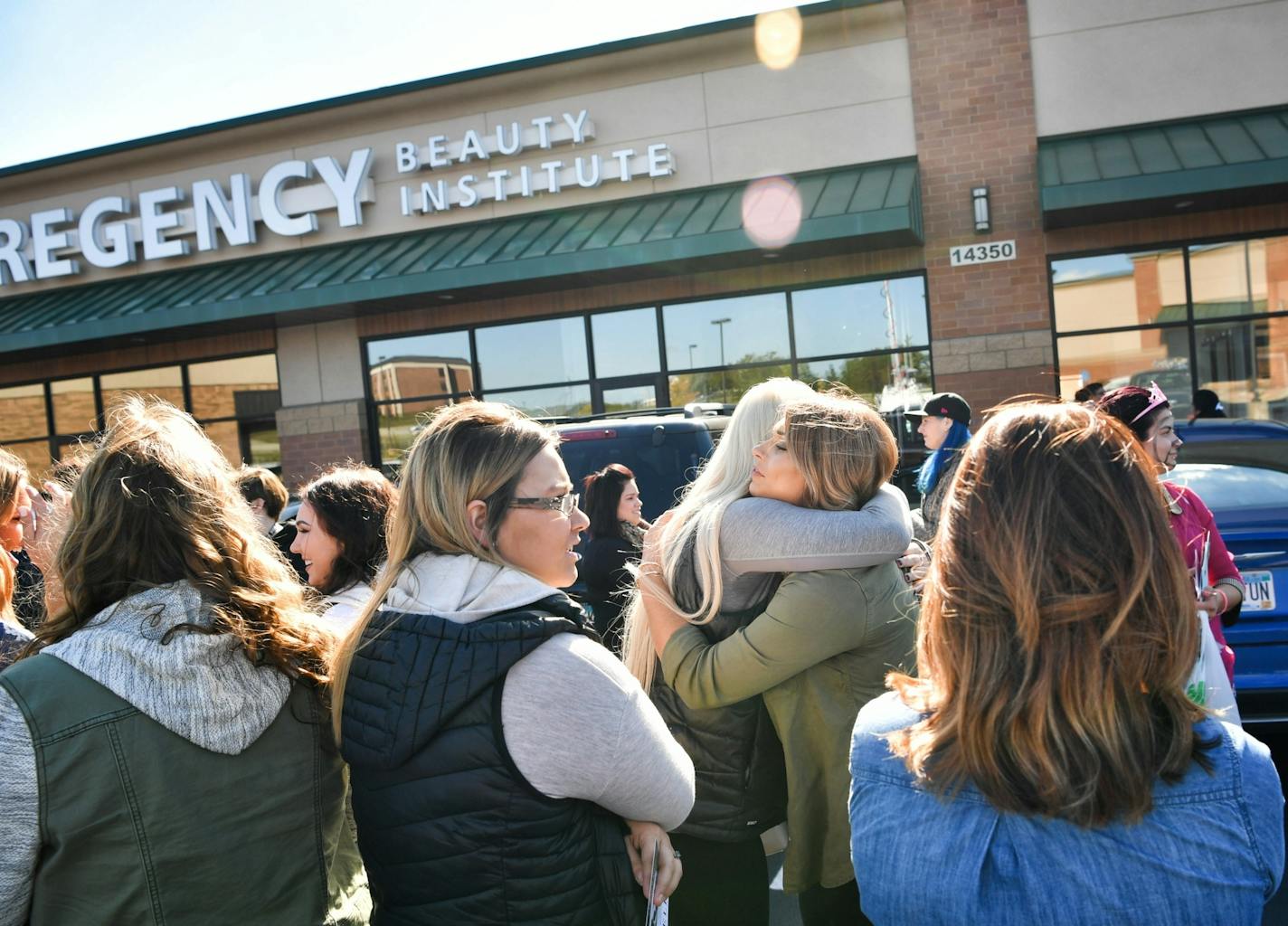 Students hugged and cried as they waited to collect their personal items from the Burnsville location of Regency Beauty Institute which abruptly closed all of its 79 locations.