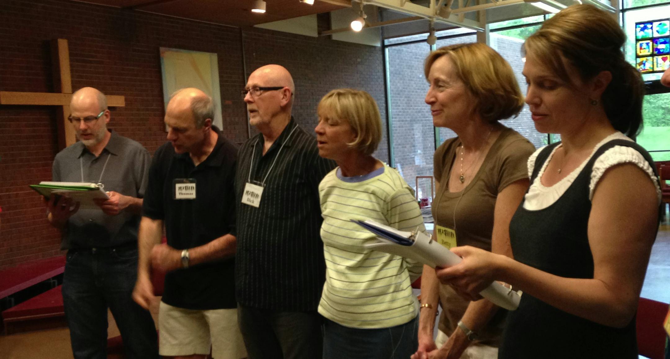 Photo by Monie Tillman:Member of One World Community Choir and Social Club sing.