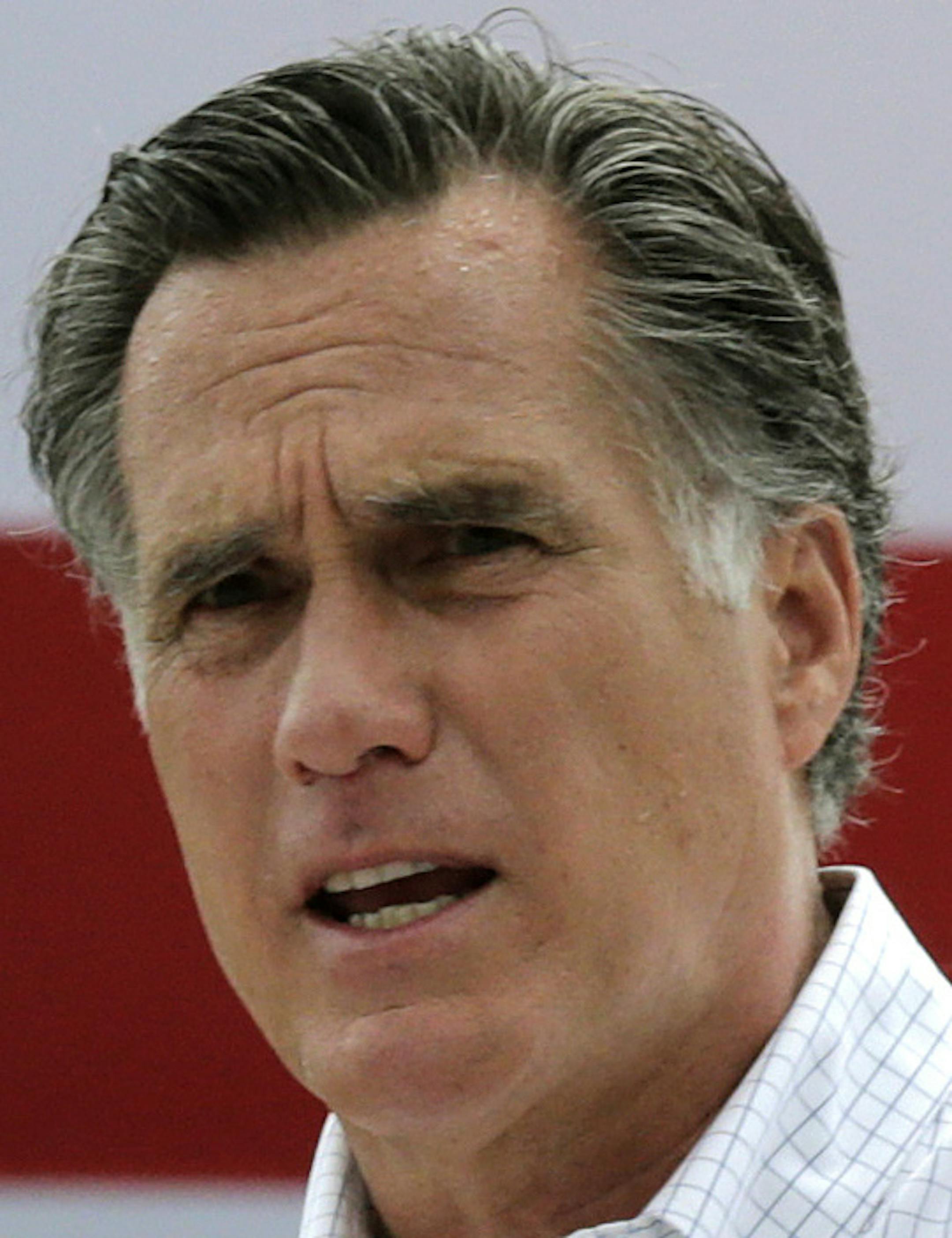 FILE - In this July 2, 2014, file photo, Mitt Romney, the former Republican presidential nominee, addresses a crowd of supporters while introducing New Hampshire Senate candidate Scott Brown at a farm in Stratham, N.H. Romney told a small group of Republican donors that he's eying a third run at the White House. The GOP's last presidential nominee held a private meeting with prominent donors in New York on Friday, Jan. 9, 2015. He told the group he's seriously considering launching another presi